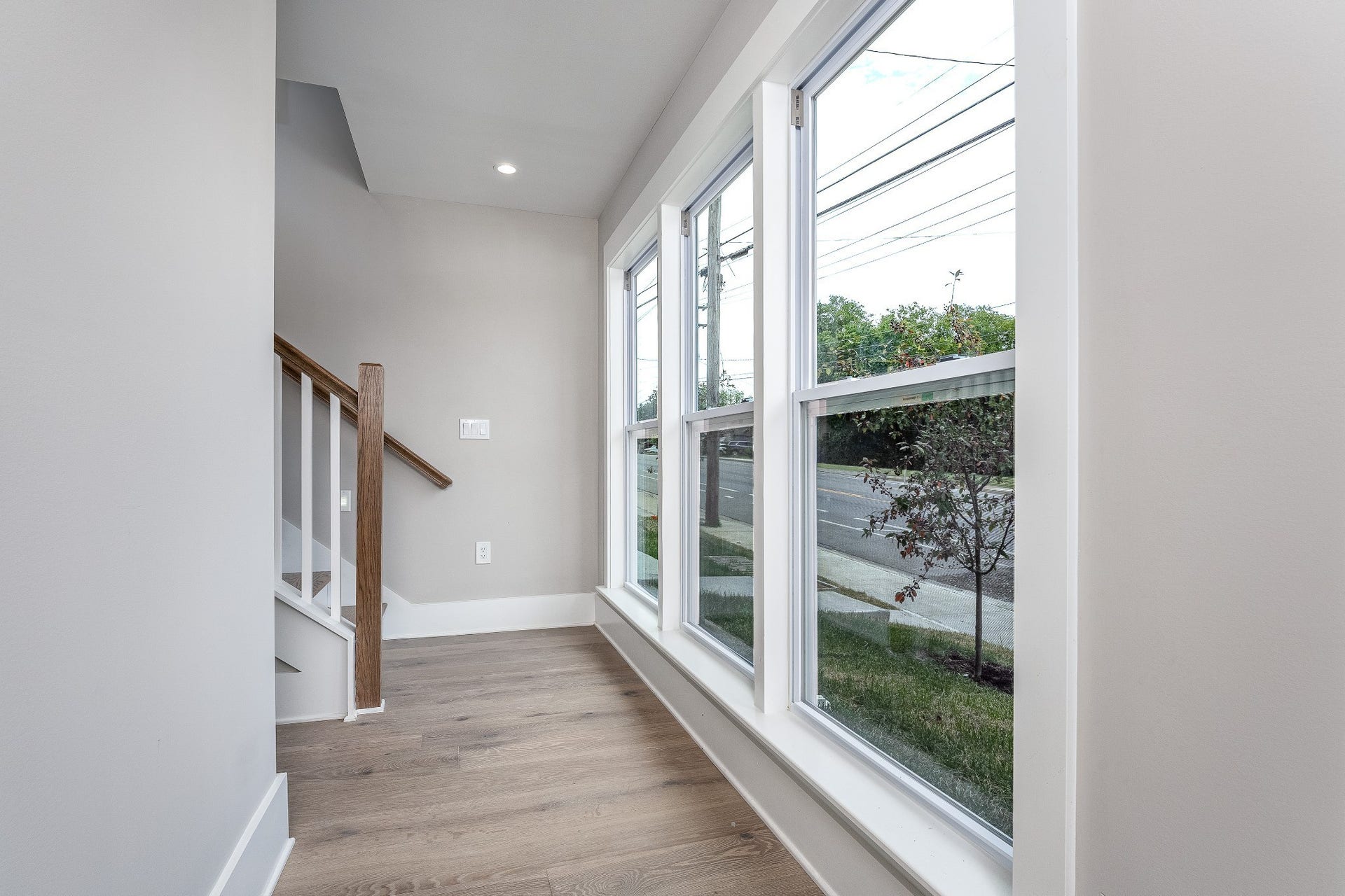 428 E Trinity Ln, #B, Nashville, TN 37207 Entry Hall of first floor with view of Stairs that lead to the Bedroom w/ensuite Bath, Garage and spacious Main level Living room, Kitchen Combo.