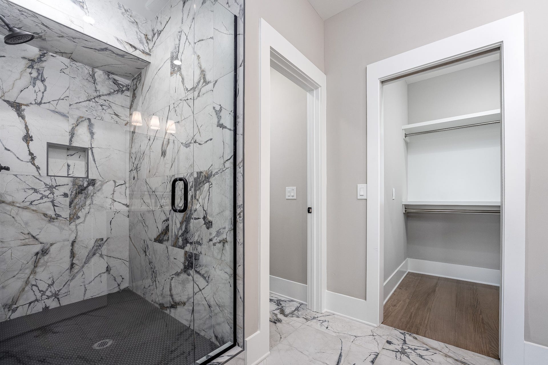 428 E Trinity Ln, #B, Nashville, TN 37207 Italian Tile Shower Surround with Bronze accent Shower head accessories, separate private Toilet and Walk-In closet. Built-in nook for bathroom essentials.