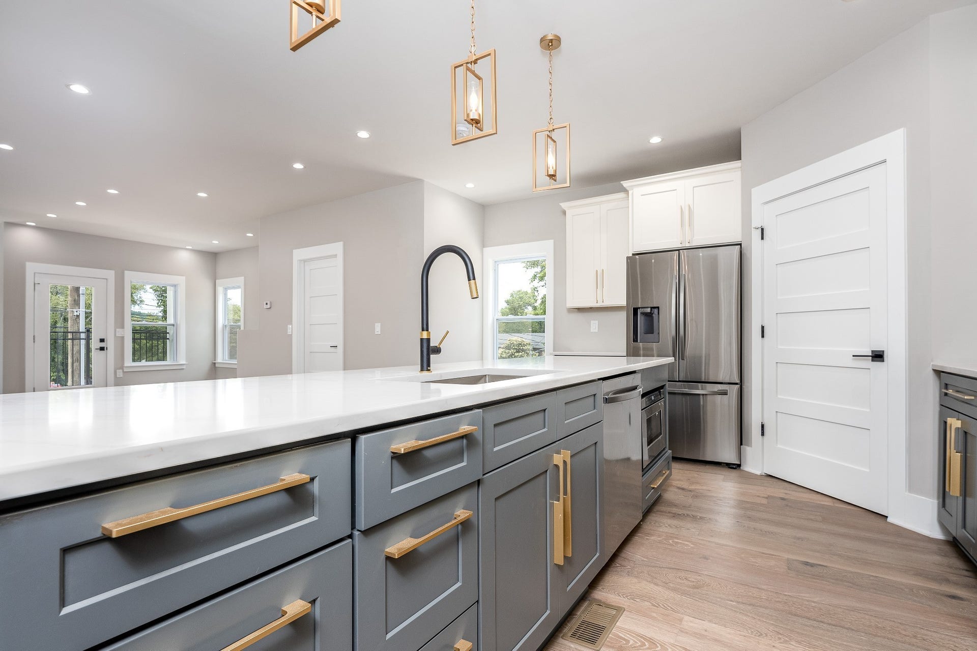 428 E Trinity Ln, #B, Nashville, TN 37207 Quartz Island complete with custom Brass Hardware, Deep Single Bowl Kitchen Sink with luxury embellished faucet with dual function spray head nozzle.
