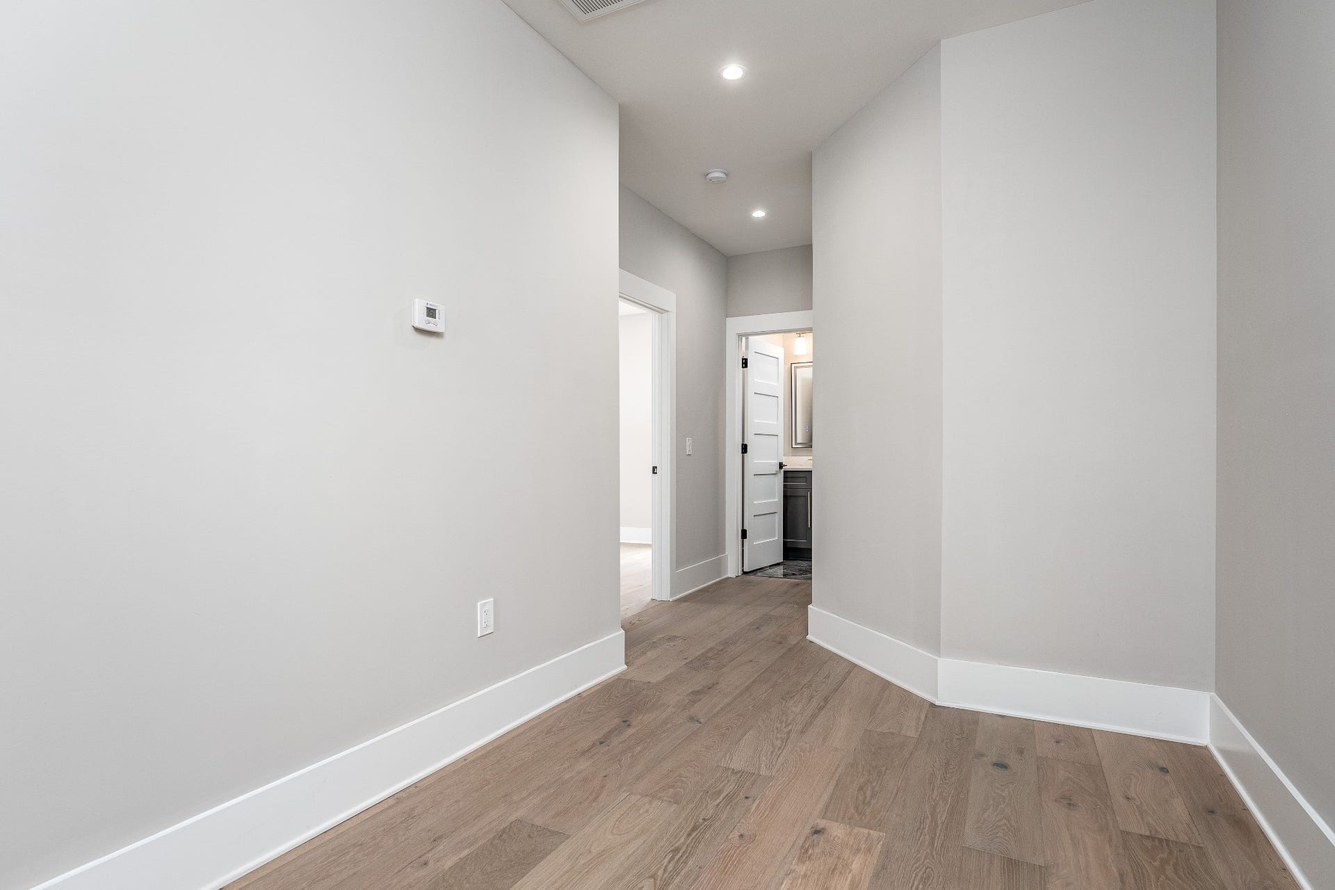 428 E Trinity Ln, #B, Nashville, TN 37207 Hallway of 3rd Level leading to Guest Bedroom and Hallway Bath, Laundry Room and Primary Bedroom.