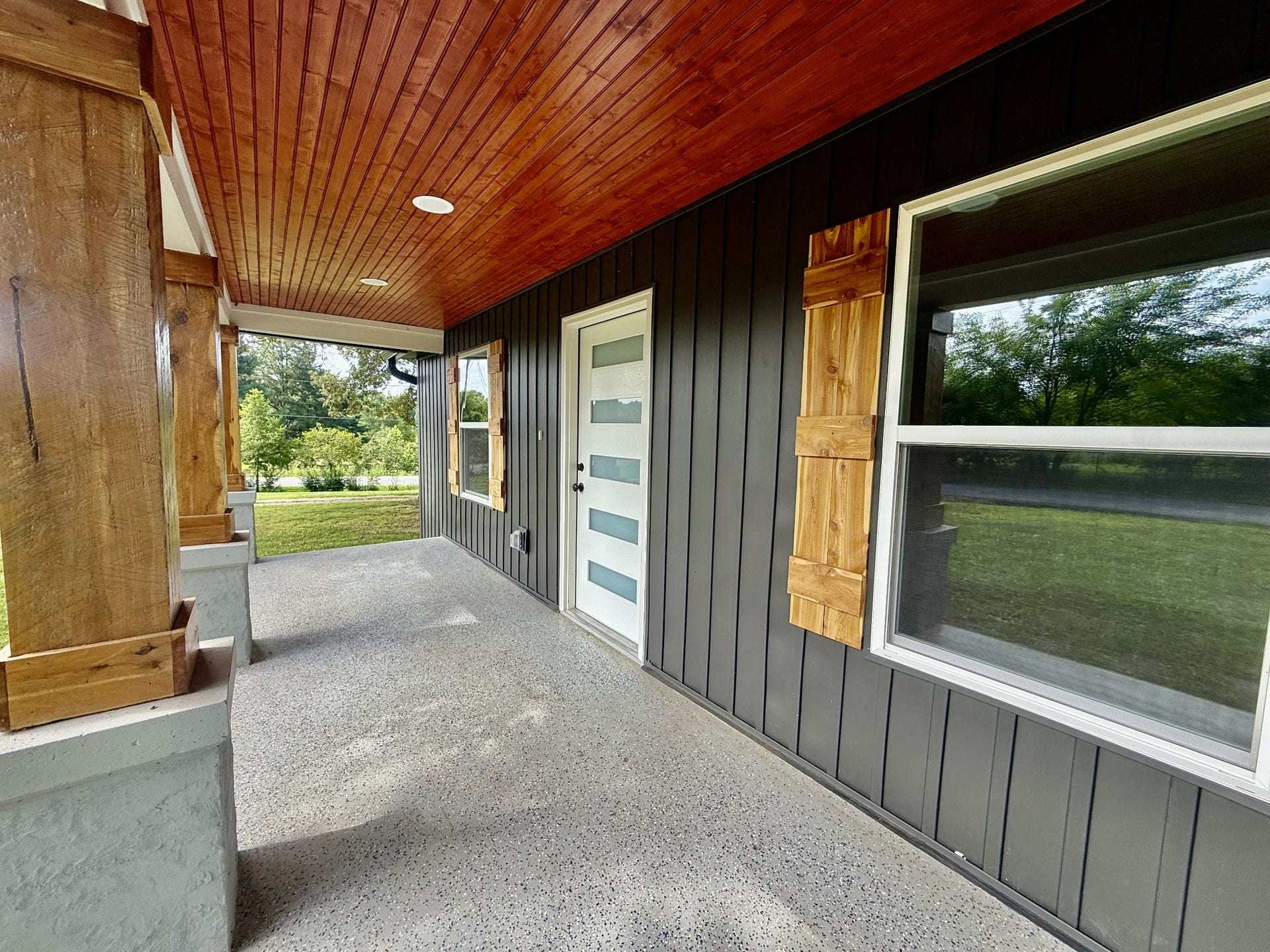 1541 Summitville Rd, Manchester, TN 37355 Beautiful front porch and front door. The home has a stained wood ceiling with recessed lighting, wood columns on the front, new windows, and siding, to name a few.