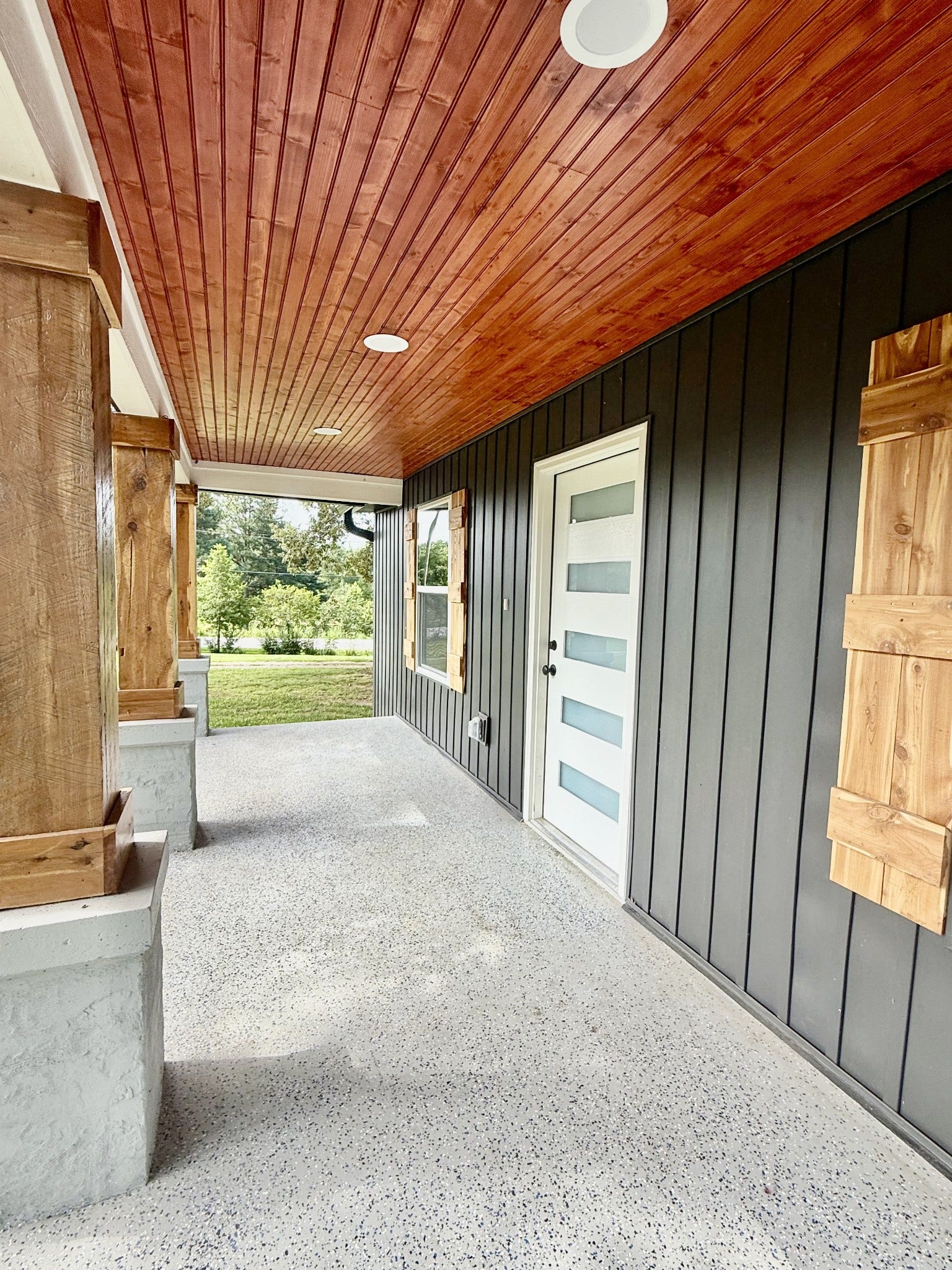 1541 Summitville Rd, Manchester, TN 37355 Covered front porch with stained wood ceilings, recessed lighting, and beautiful stained columns