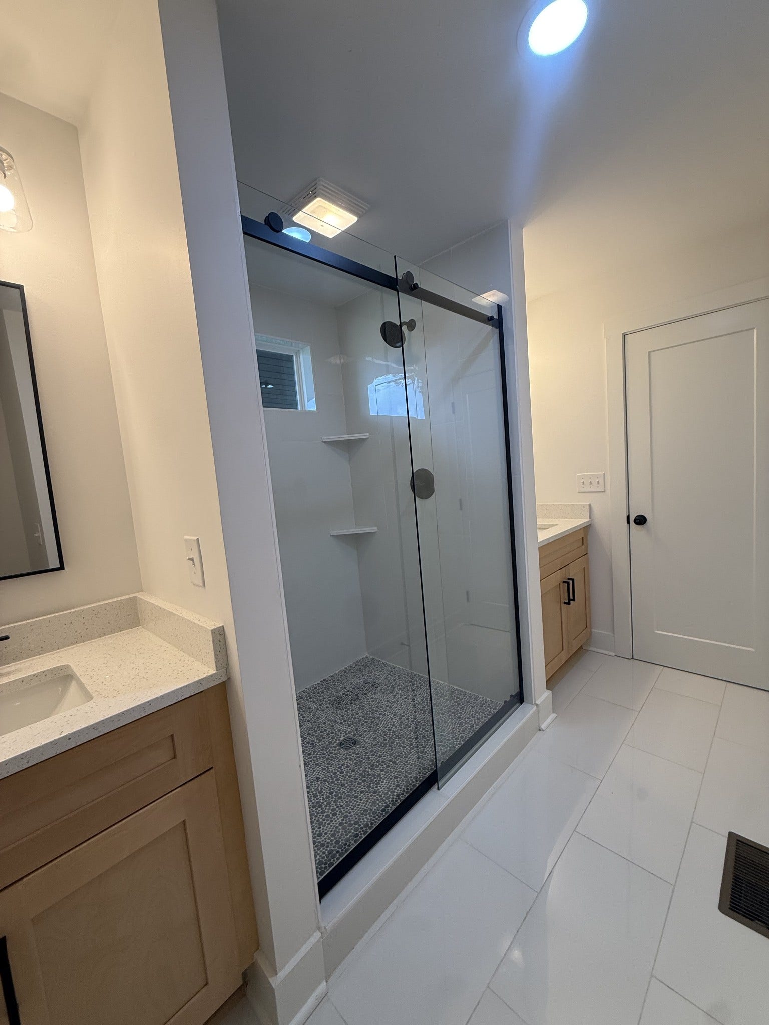 1541 Summitville Rd, Manchester, TN 37355 Primary Bath suite has double vanities with beautiful cabinetry and a large walk-in tile shower