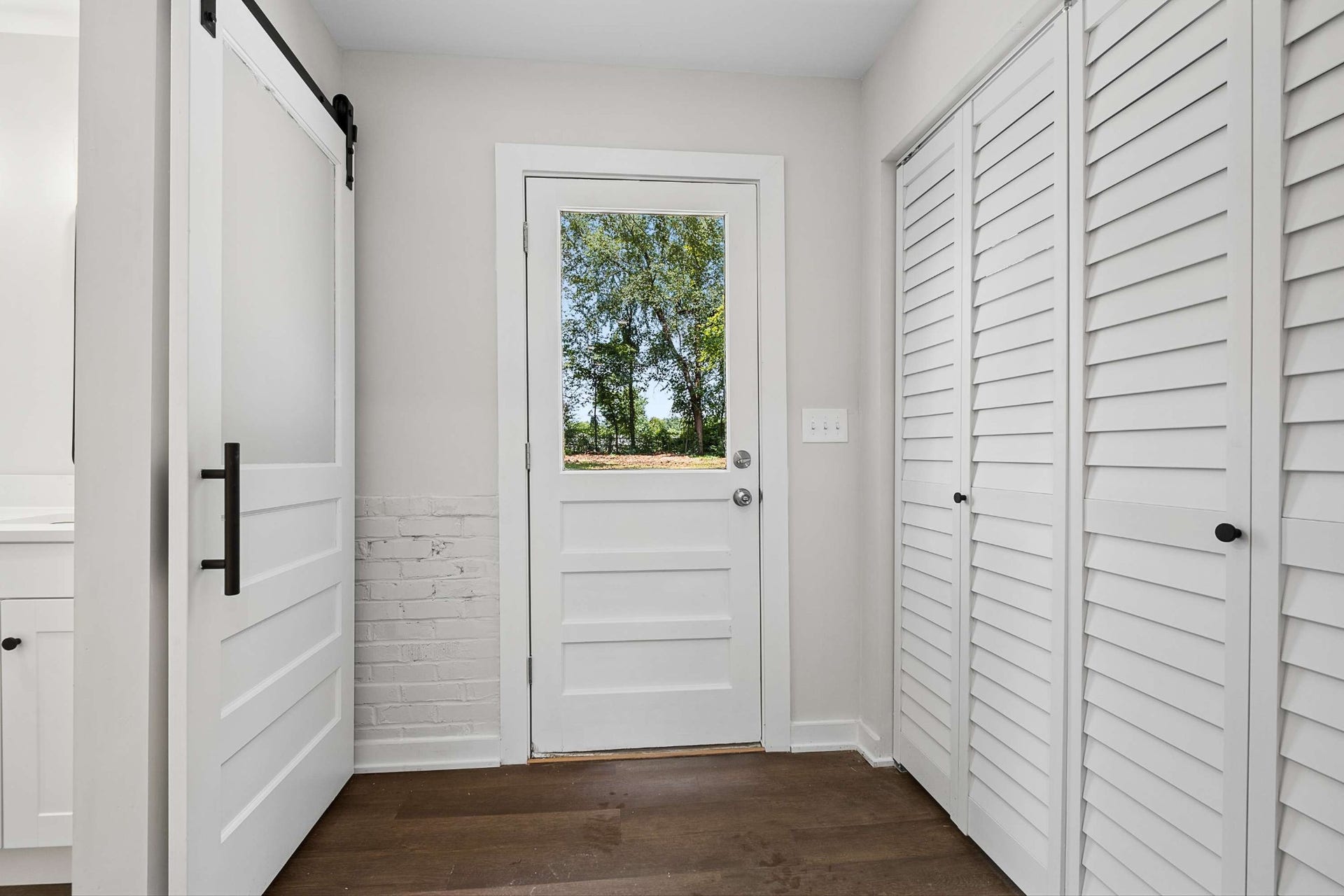 3701 Travis Ct, Murfreesboro, TN 37130 Backdoor to the property with sliding barn door to the bathroom and doors to the laundry room