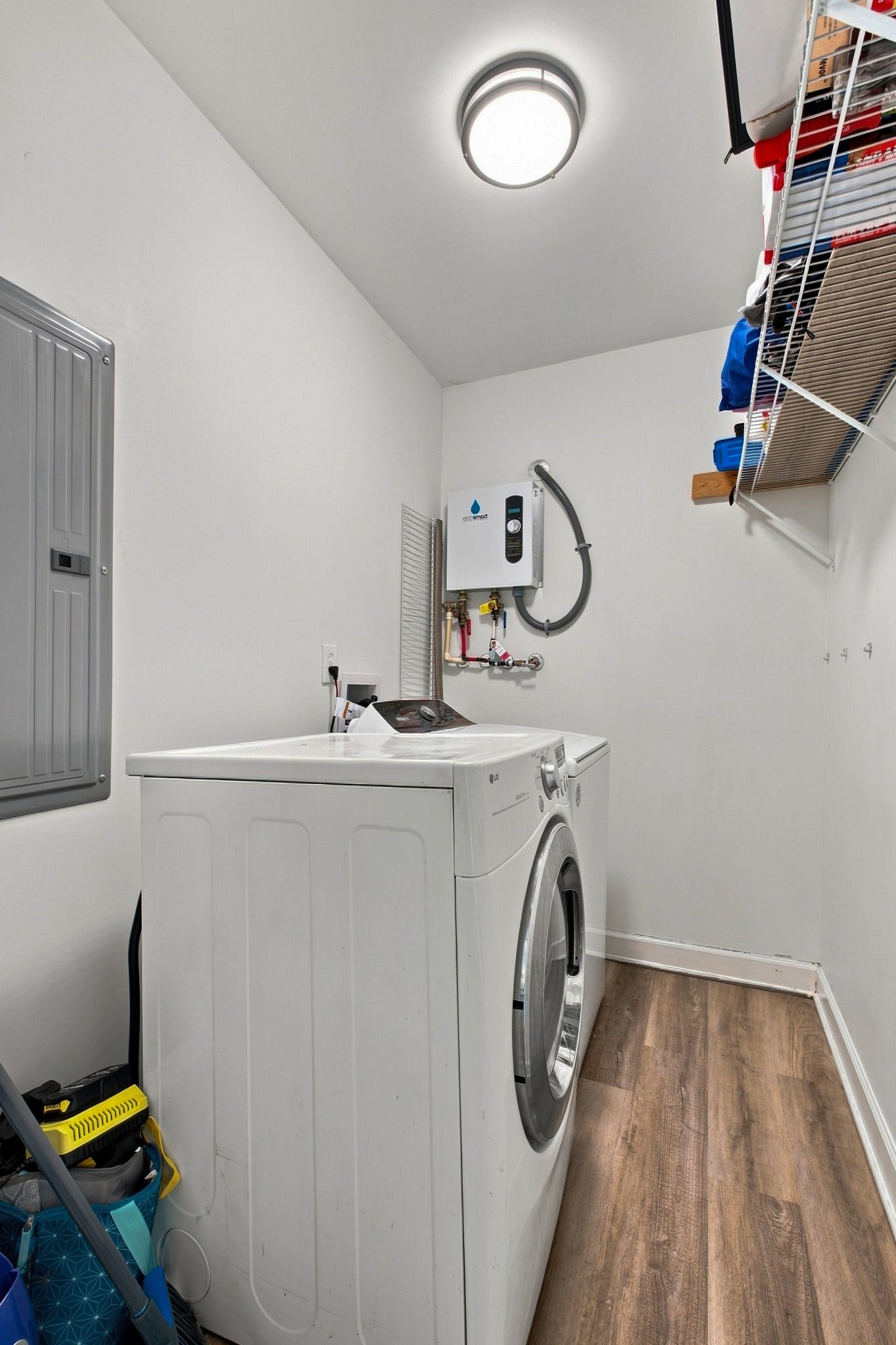 3312 Masonwood Dr, Nashville, TN 37207 The functional laundry room includes additional storage and a tankless water heater, combining everyday convenience with long-term efficiency