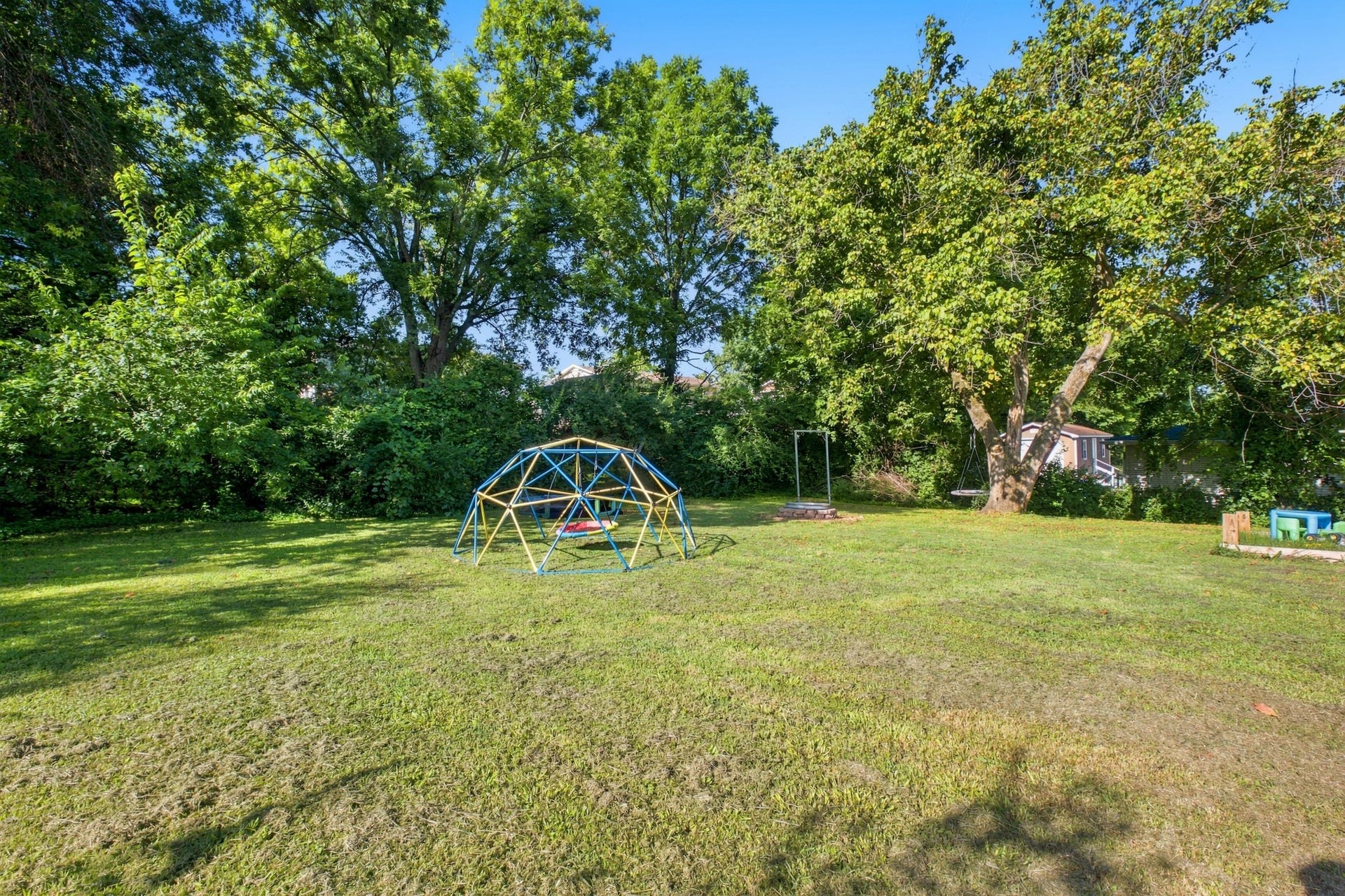 3312 Masonwood Dr, Nashville, TN 37207 The expansive, level backyard offers endless possibilities for play, gardening, pets, or future additions, all surrounded by mature trees that provide shade and privacy.