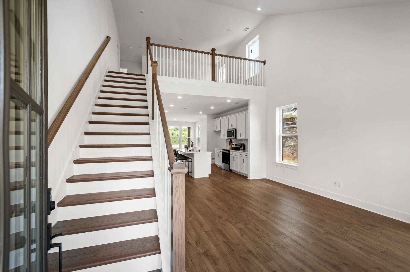 3529 Winterfell Drive, Murfreesboro, TN 37129 Soaring vaulted ceilings in the family room when you enter with gorgeous open stair railing for an open and airy feel.