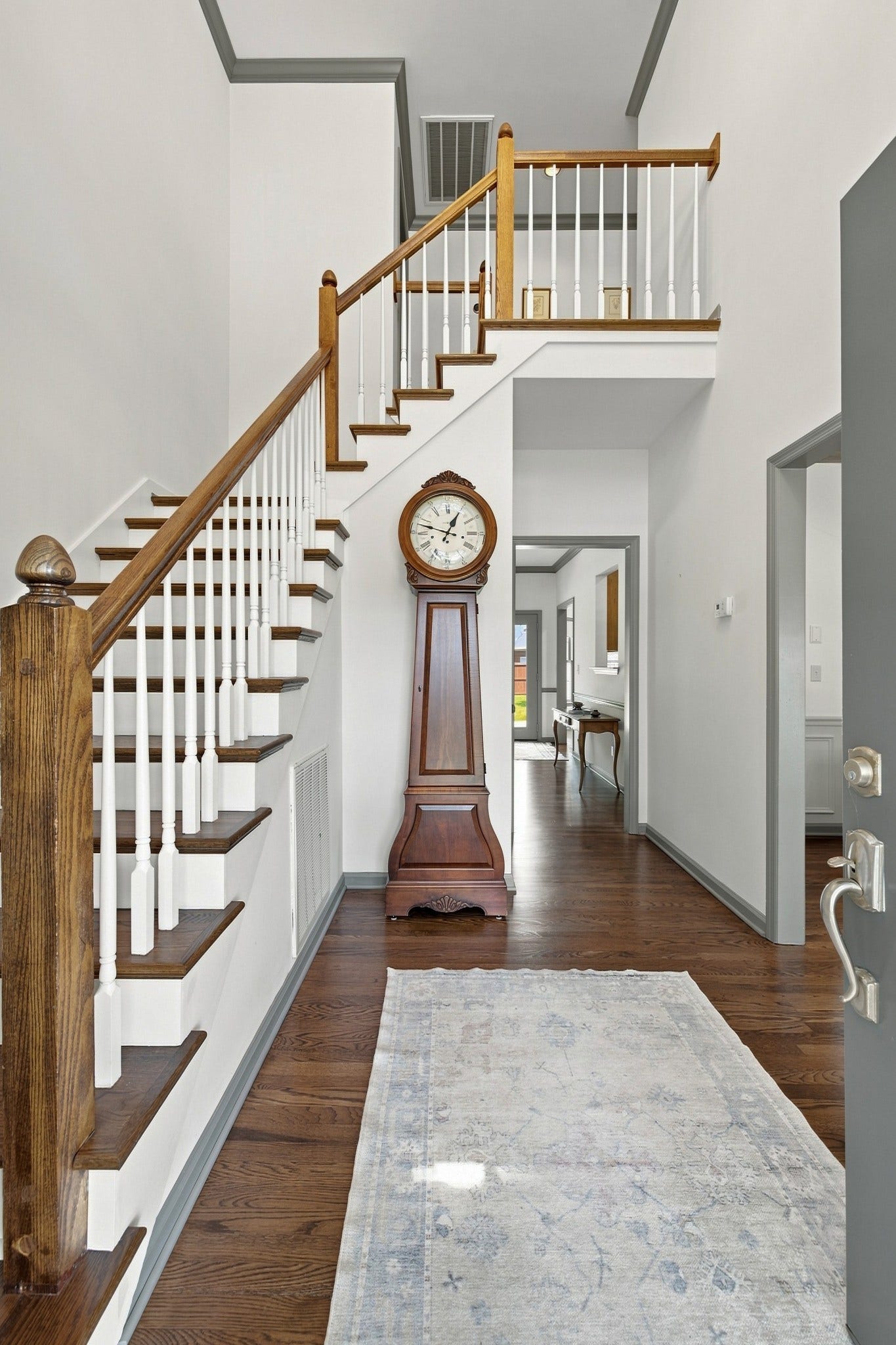 830 Banner Dr, Murfreesboro, TN 37129 Foyer area with formal dining room to the right and stair case on the left.