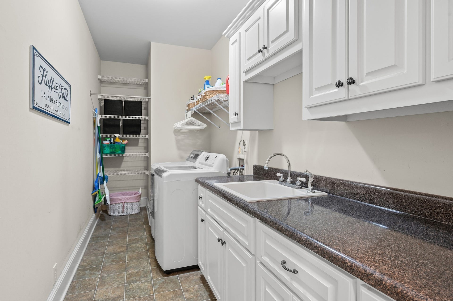 2638 Big Eagle Trl, Murfreesboro, TN 37127 Large functional laundry room with lots of cabinets and work space.