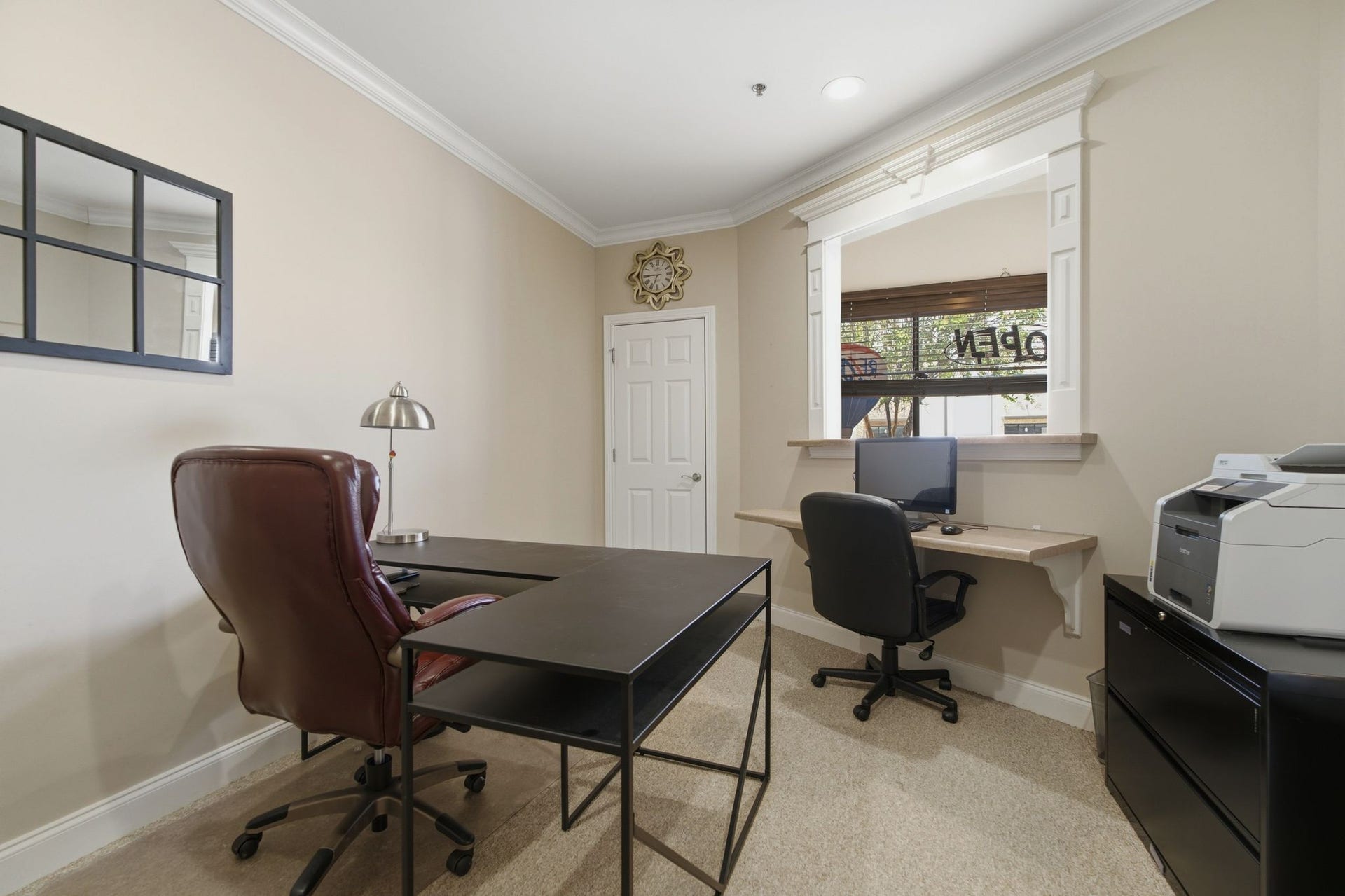 730 Middle Tennessee Blvd, Murfreesboro, TN 37129 This private office features a built-in desk and reception window, making it ideal for a receptionist or administrative workspace.