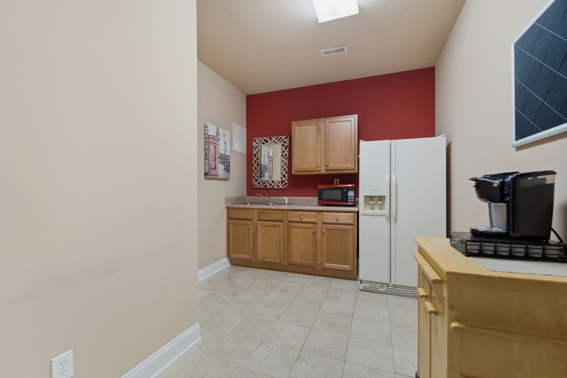730 Middle Tennessee Blvd, Murfreesboro, TN 37129 The kitchen features tile flooring, sink & microwave.