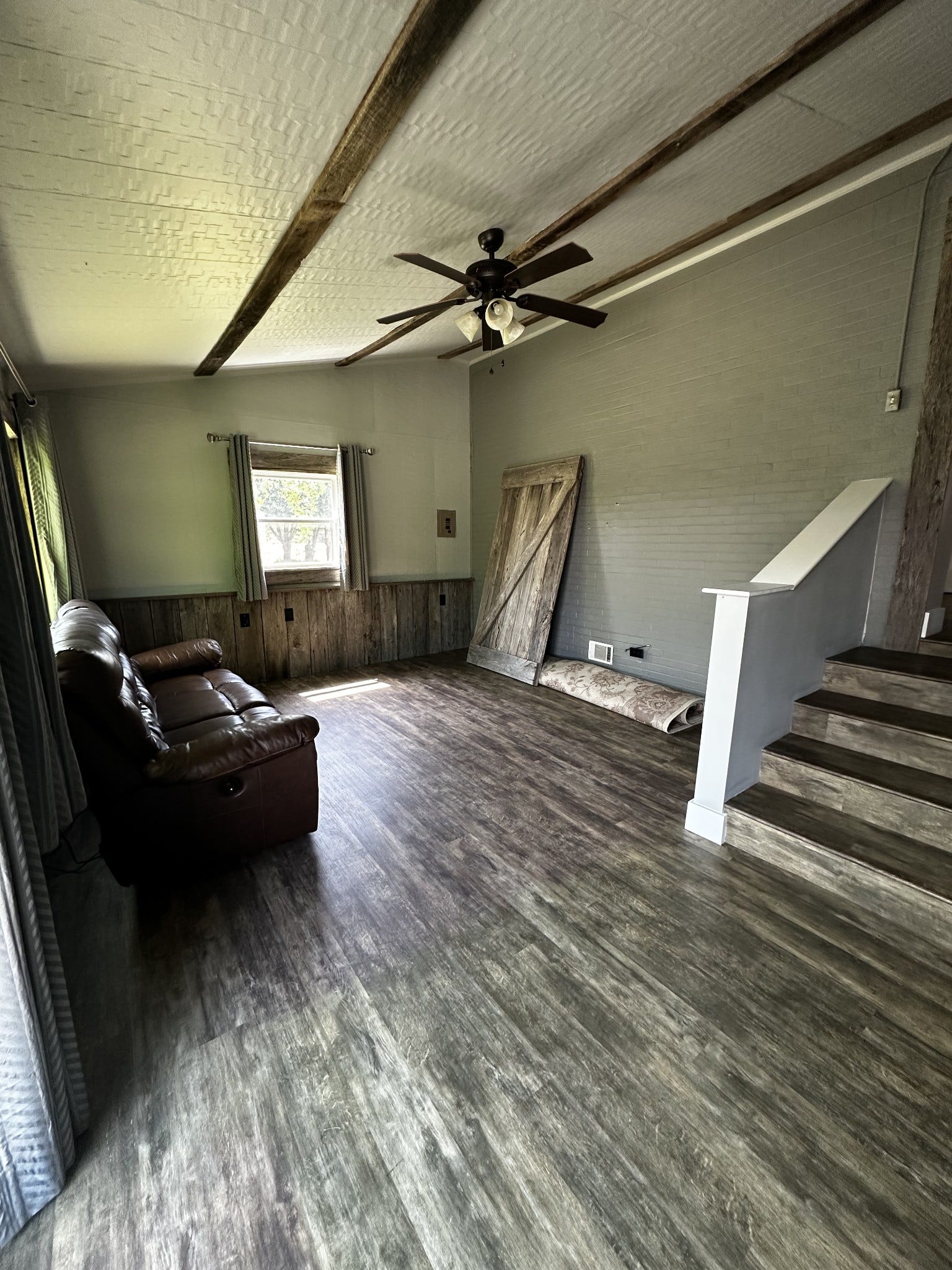 2930 Murfreesboro Hwy, Manchester, TN 37355 Den with large windows, vinyl flooring and reclaimed barn wood trim