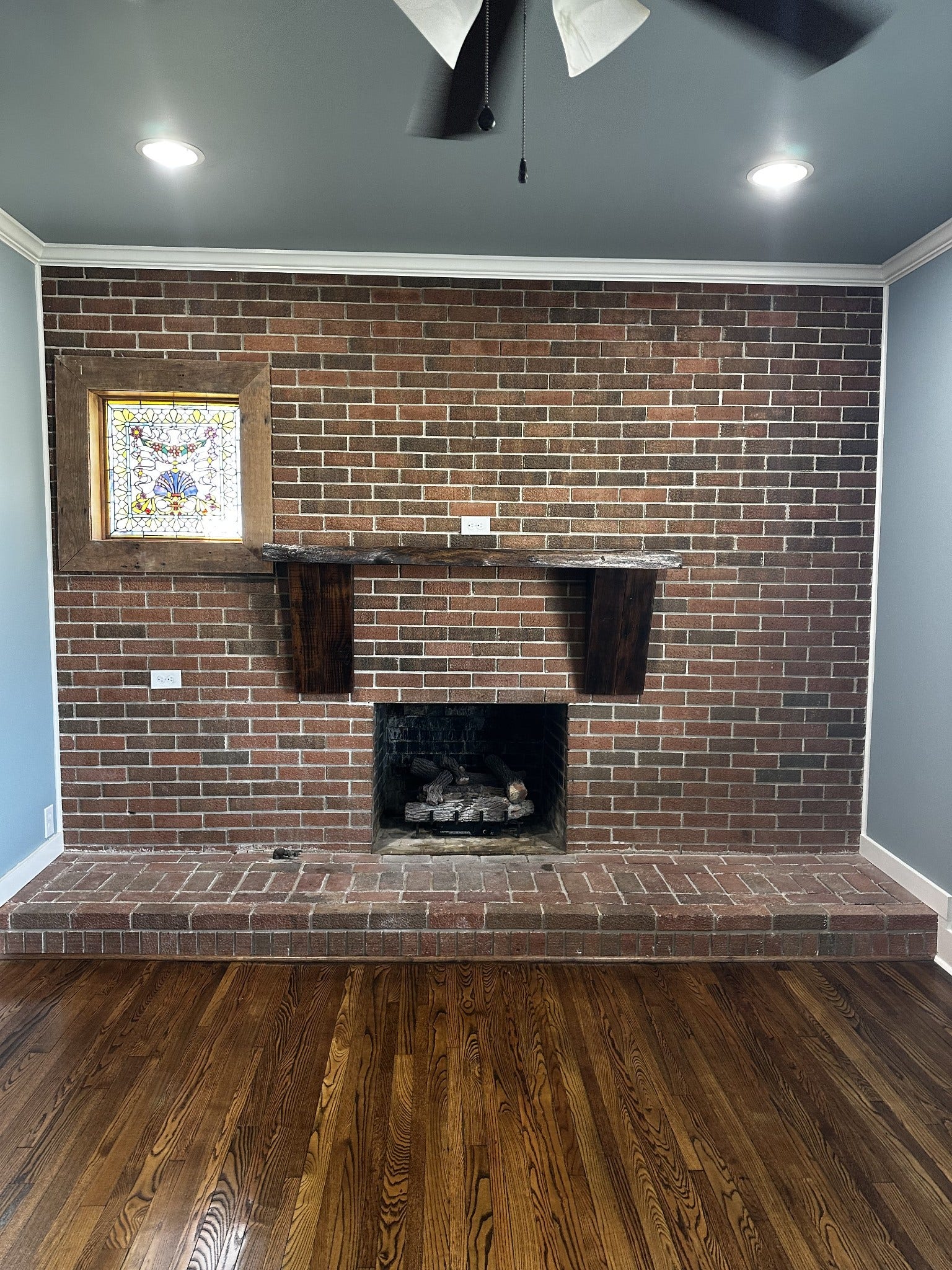 2930 Murfreesboro Hwy, Manchester, TN 37355 Fireplace with wood mantle and gorgeous stain glass window
