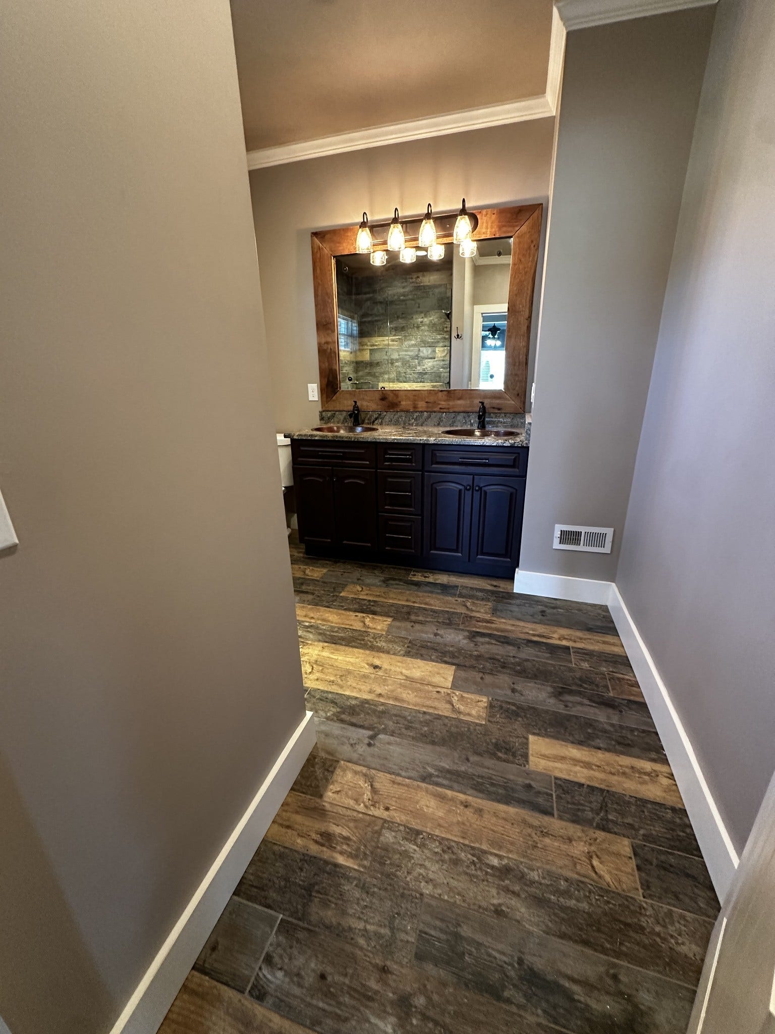 2930 Murfreesboro Hwy, Manchester, TN 37355 Master Bath with beautiful wood looking tile, newer cabinets with soft close, double copper sinks and granite countertops