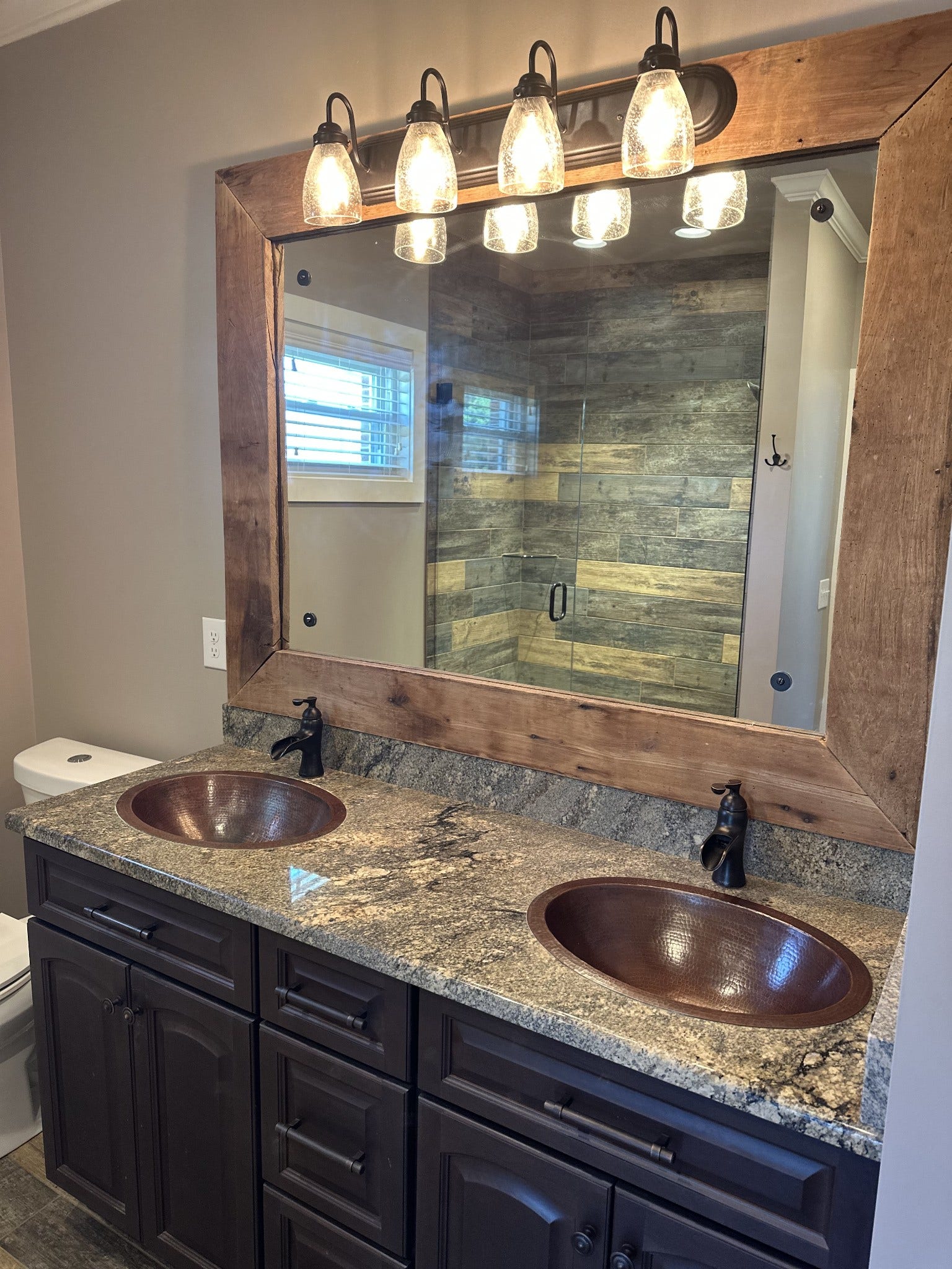 2930 Murfreesboro Hwy, Manchester, TN 37355 Master Bath with double copper sinks, granite countertops, large mirror framed with reclaimed barn wood and large tile shower