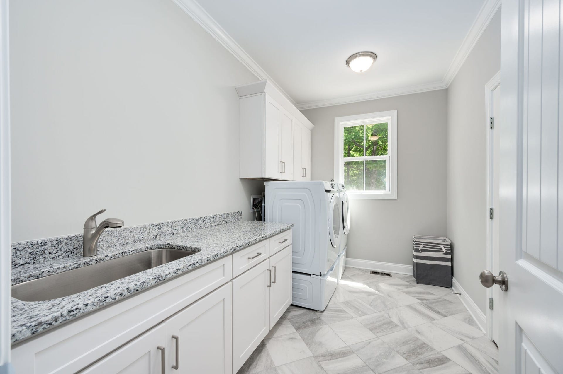 545 Delacy, Fairview, TN 37062 Large laundry room. Folding counter and sink. Washer and dryer provided.