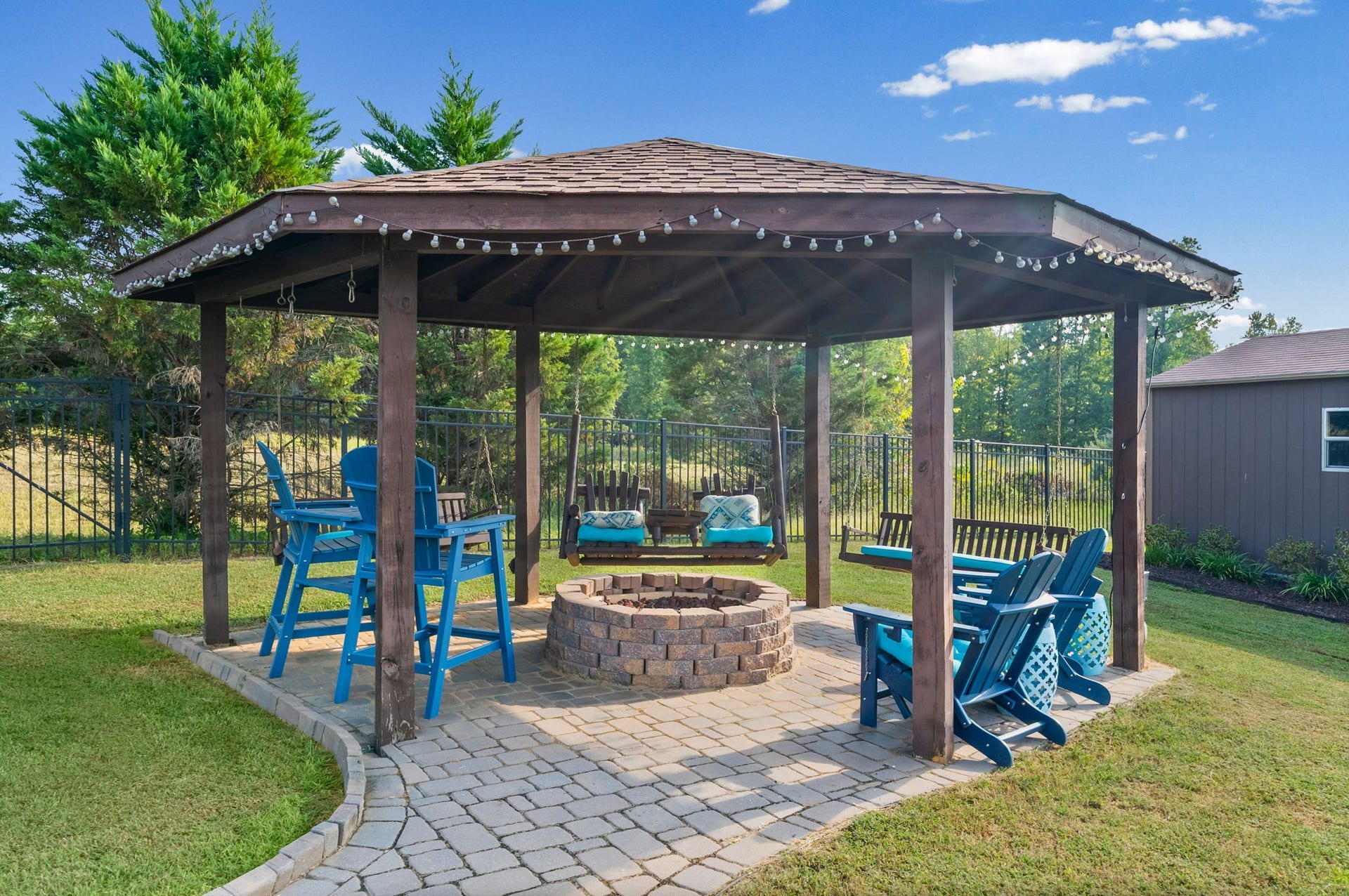 510 Falcon Crk, Lebanon, TN 37087 Gather beneath the backyard gazebo, where a paver patio, seating, and a central fire pit create a spot to relax or entertain.