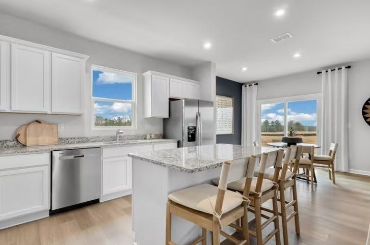 ***Photo is from a previously built Whimbrel model home***

The island provides additional storage space while also being the perfect location from quick meals.