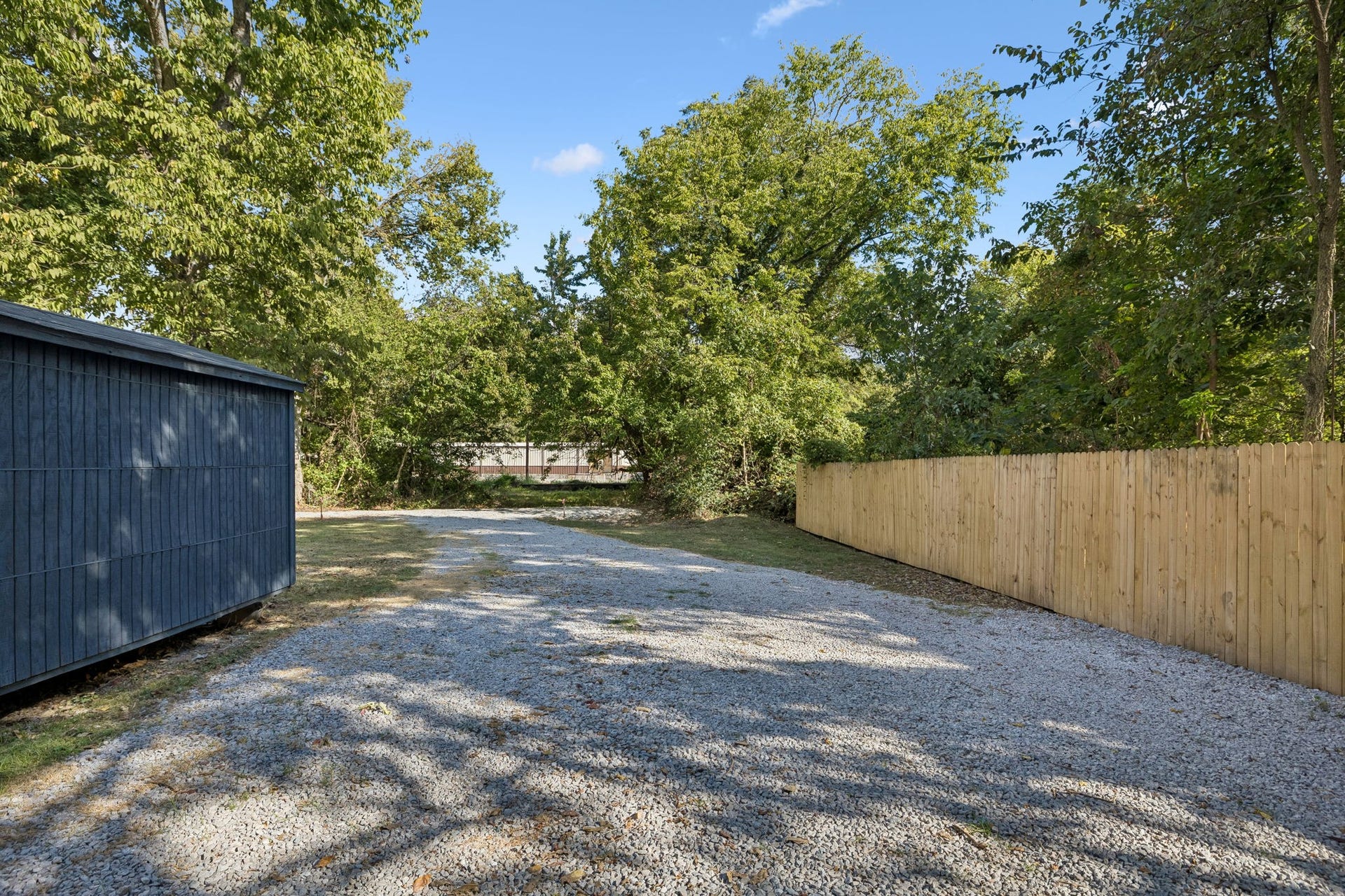 209 Olive St, Mount Pleasant, TN 38474 Alley drive and parking with fresh gravel