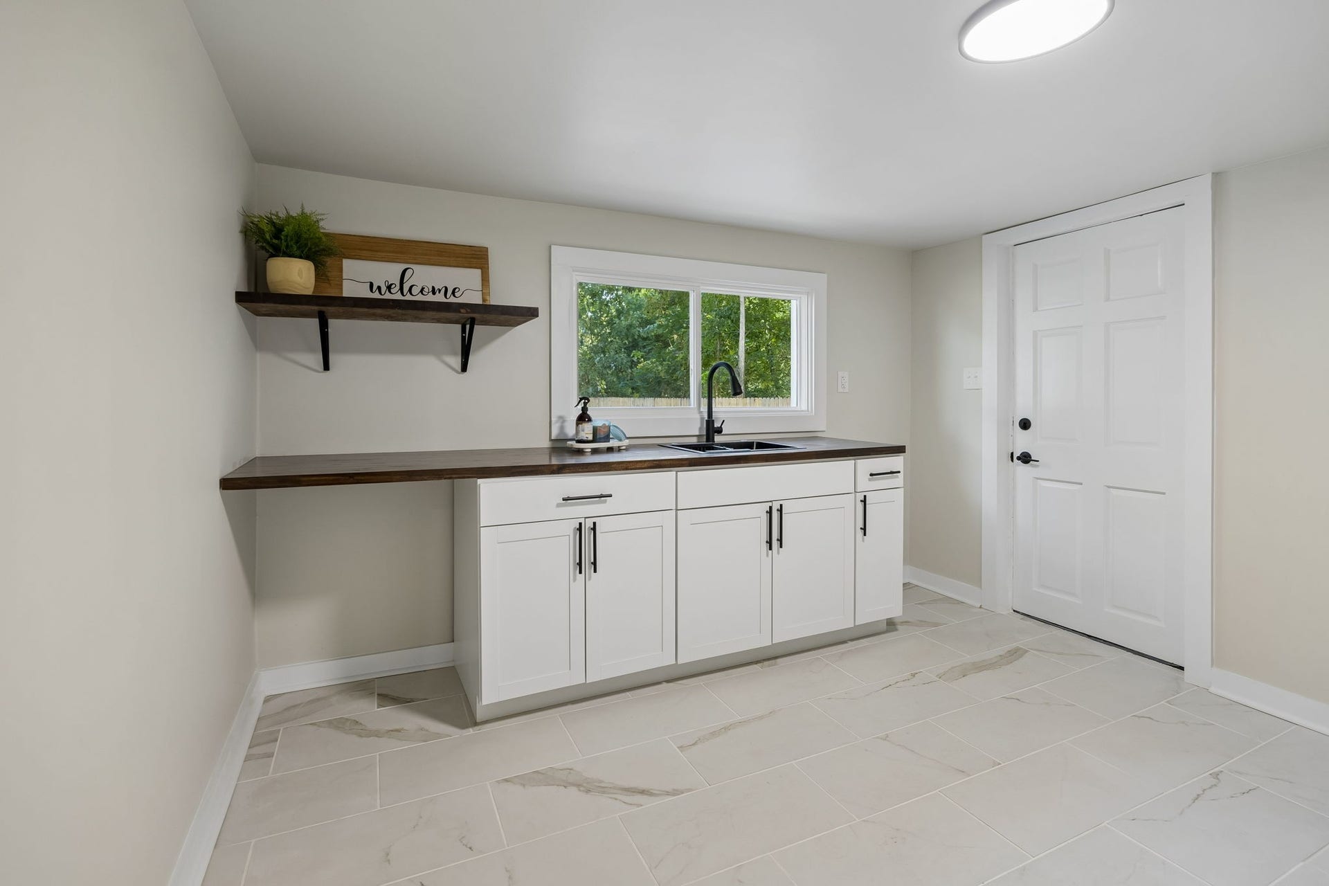 209 Olive St, Mount Pleasant, TN 38474 Laundry Room with sink and cabinets!