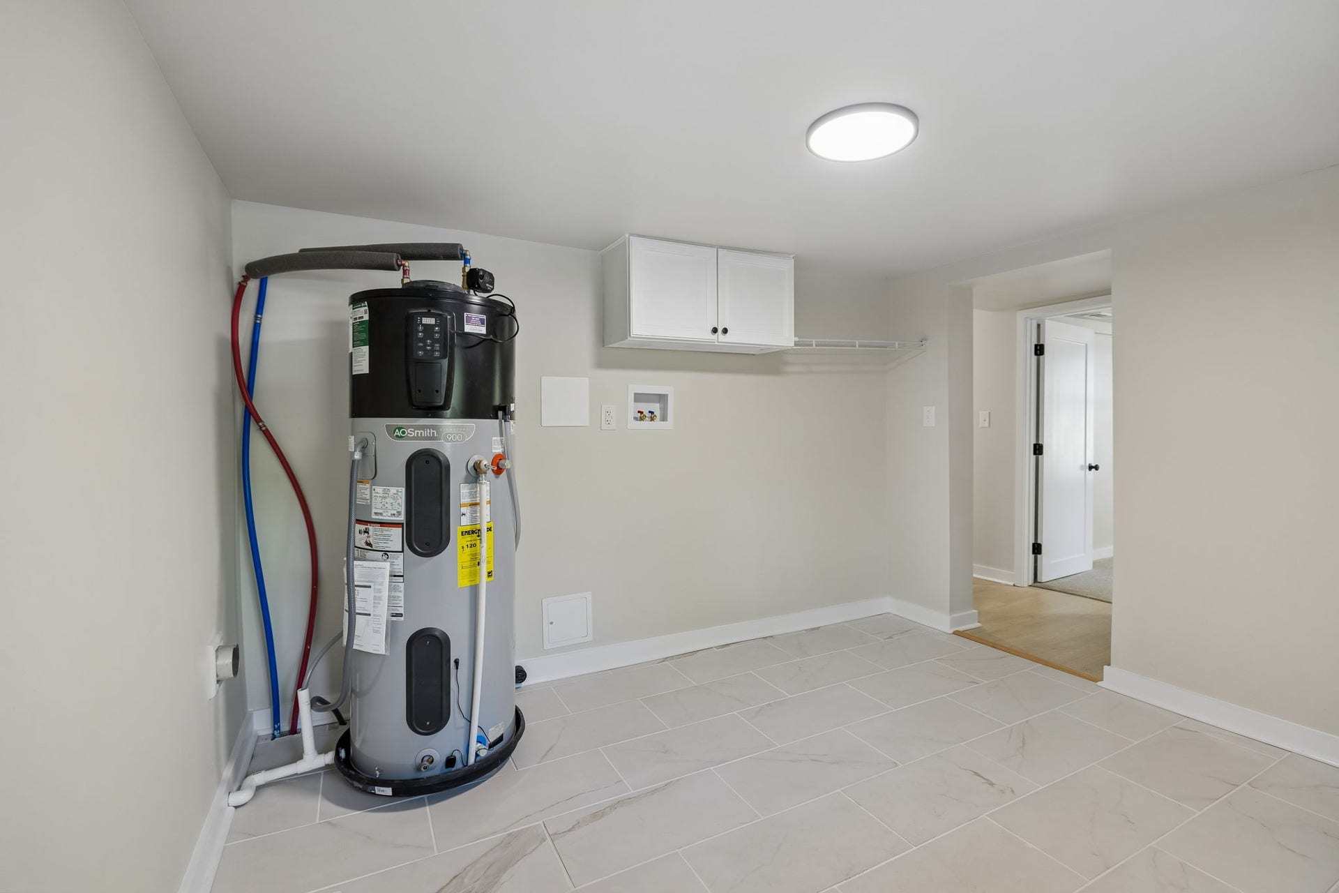 209 Olive St, Mount Pleasant, TN 38474 Brand new water heater in the large laundry room.