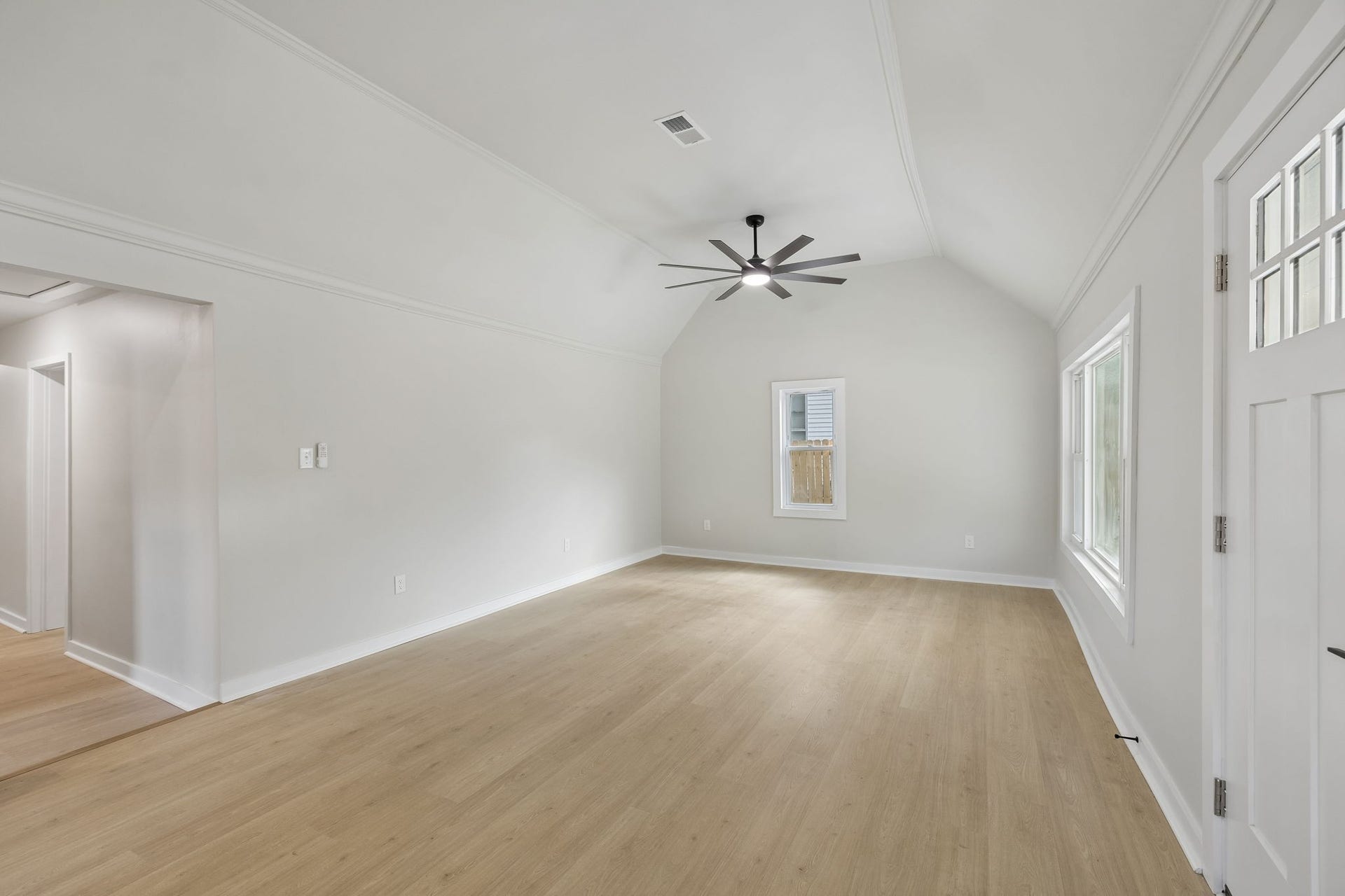 209 Olive St, Mount Pleasant, TN 38474 Welcoming open floor plan with vaulted ceilings and picture window.