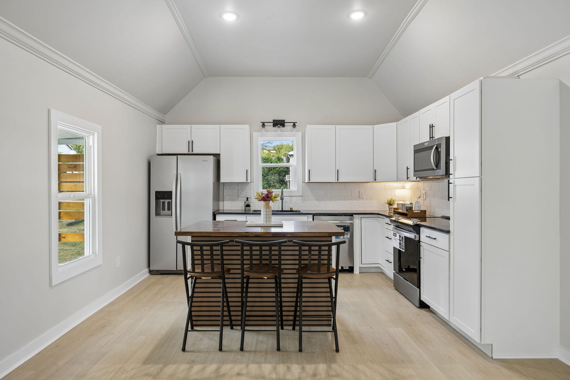 209 Olive St, Mount Pleasant, TN 38474 Brand new kitchen with NEW Stainless Steel appliances, new cabinets, solid surface countertops and butcher block island with seating.