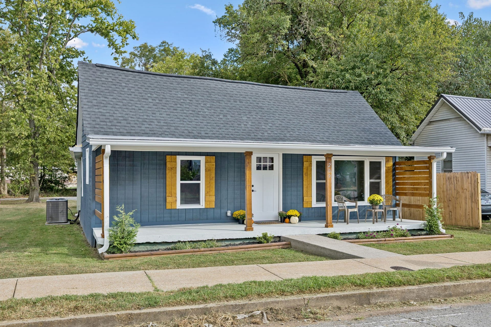 209 Olive St, Mount Pleasant, TN 38474 Rocking chair front porch with new wood shutters and paint! Home has new roof too!