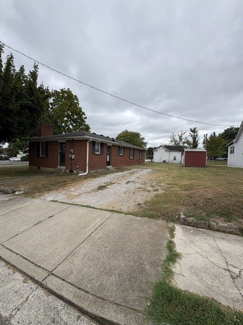 1400 S High St, Columbia, TN 38401 Rear view showing drive and storage building