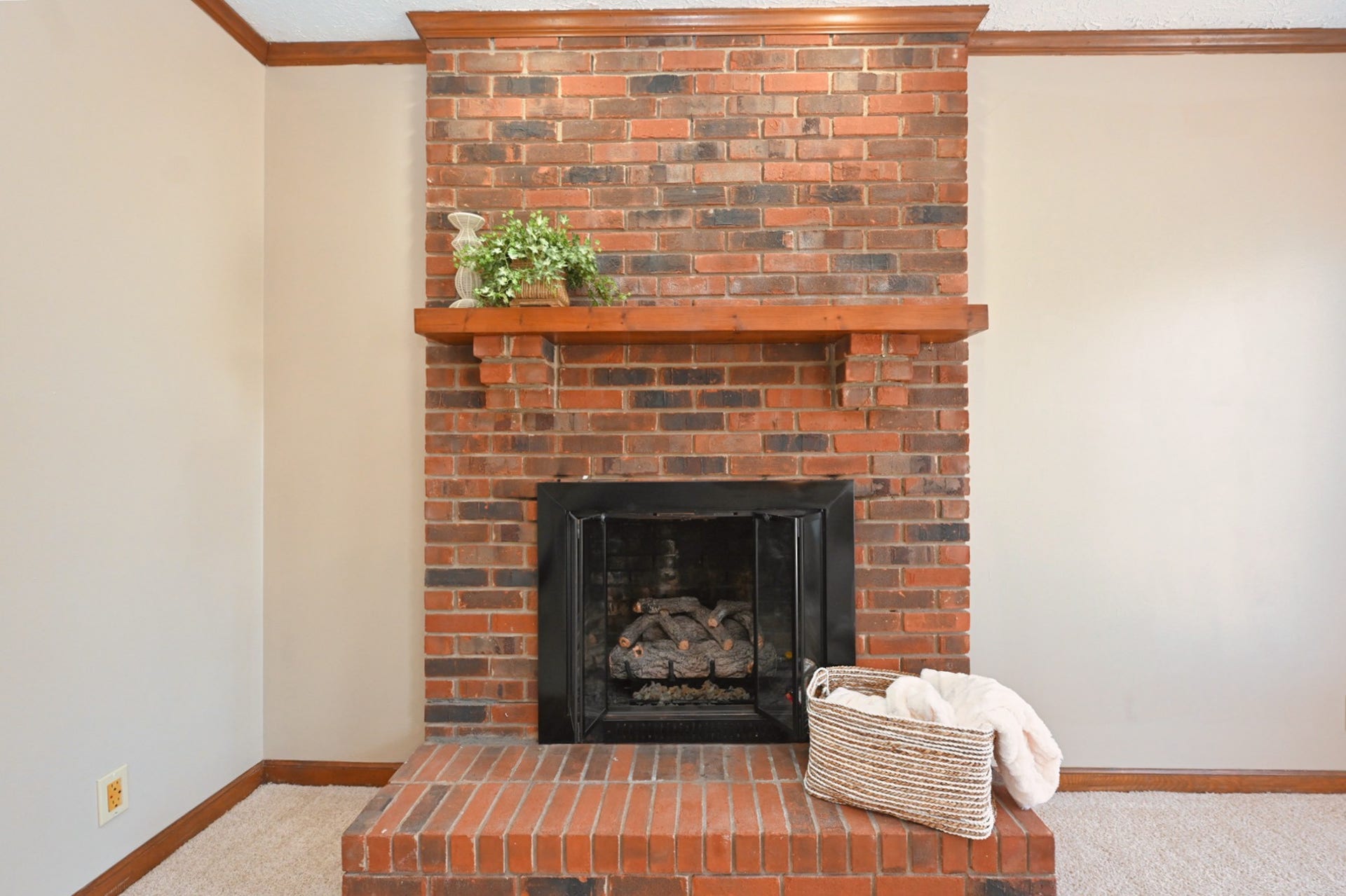 gorgeous fireplace with natural gas logs