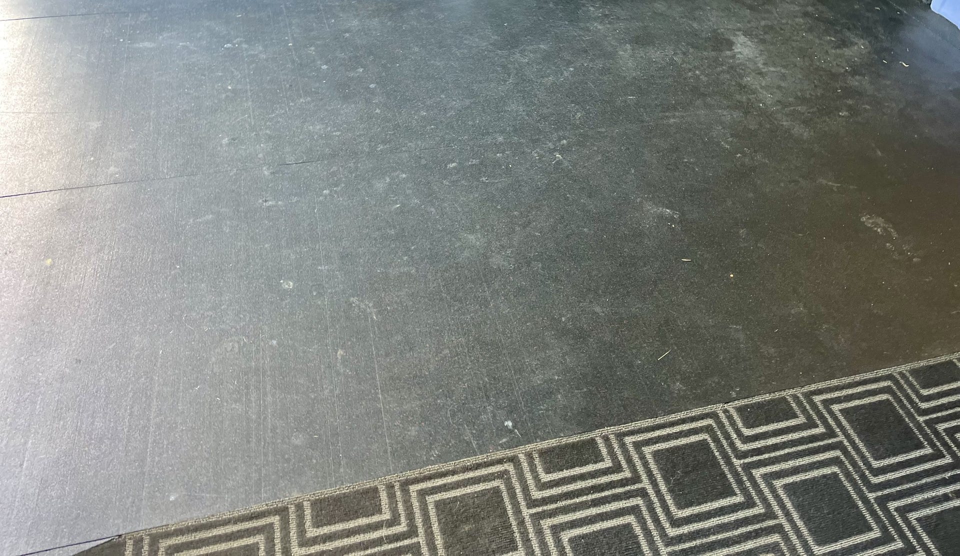 garage floor covered in gym type rubber flooring