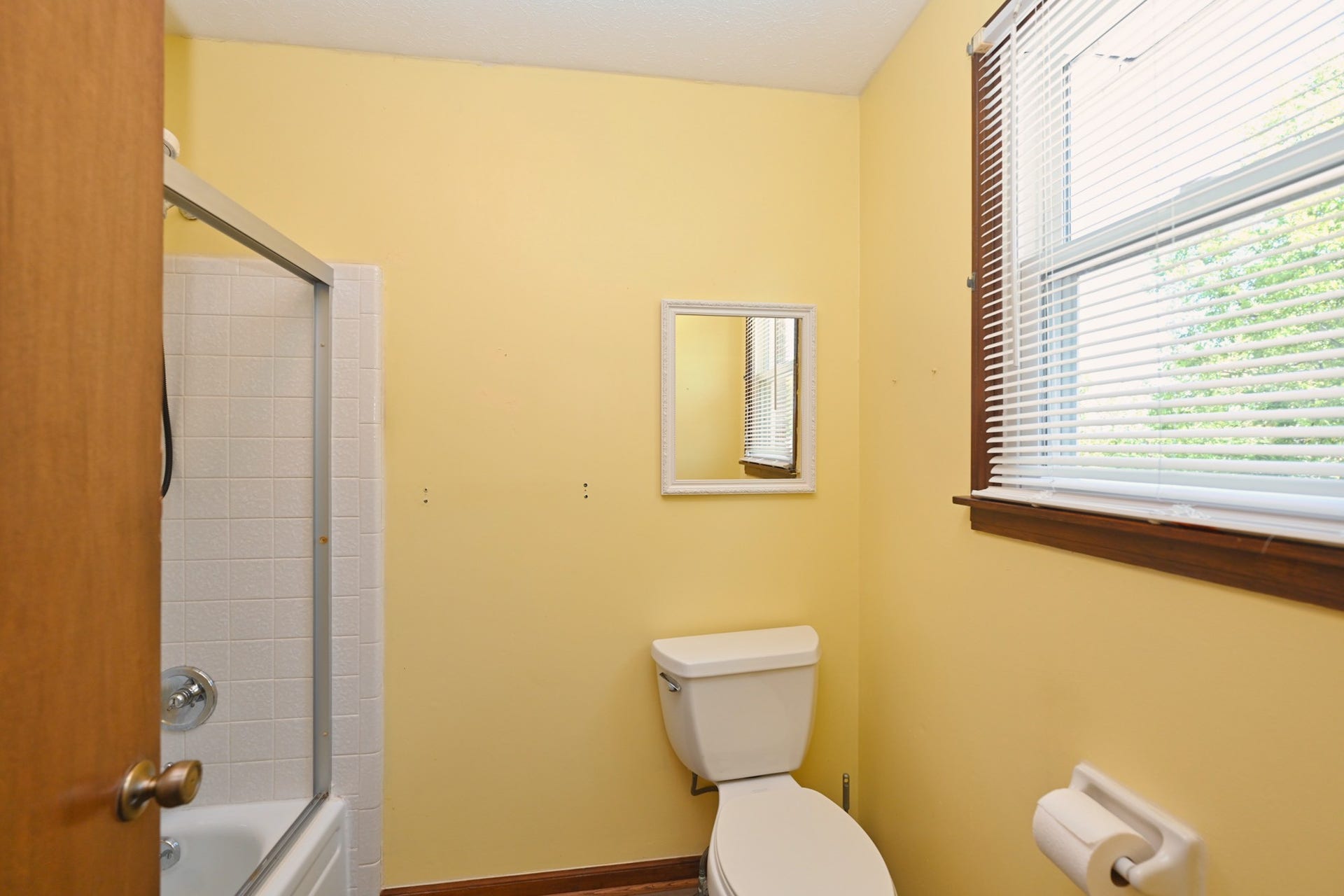 large upstairs bathroom has separate vanity area for privacy