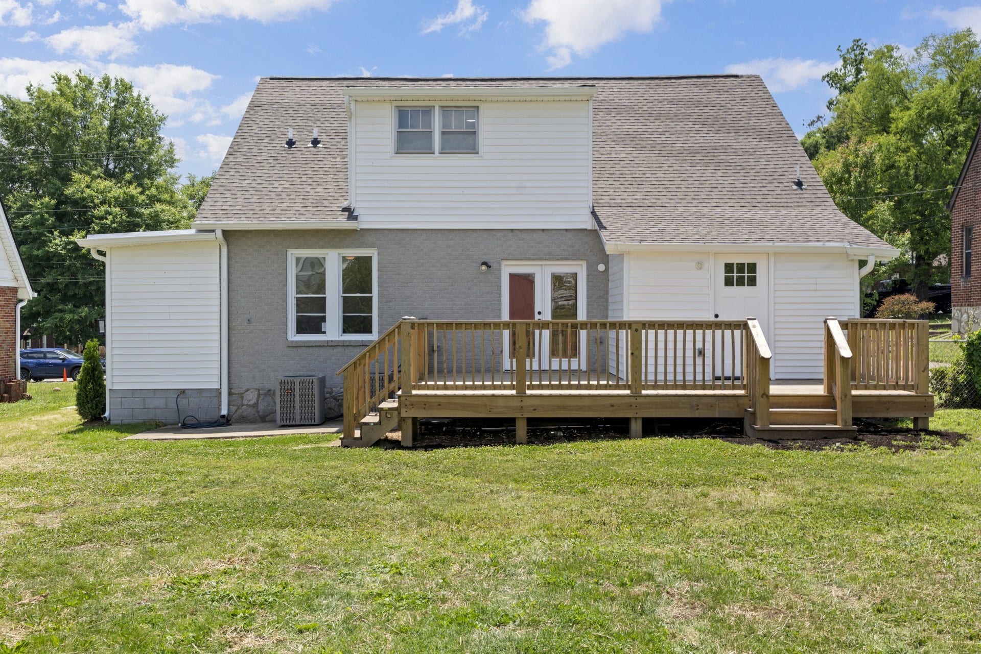 Large deck leading to both dining area and mud room.  (Deck lights added after photo)