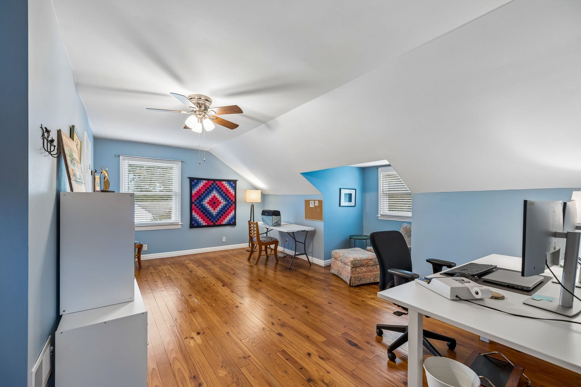 The second upstairs bedroom offers the kind of flexibility that makes a home work for the way life changes. With beautiful hardwood floors, abundant natural light, and plenty of space, it can easily adapt to bedrooms, hobbies, play, or work-from-home