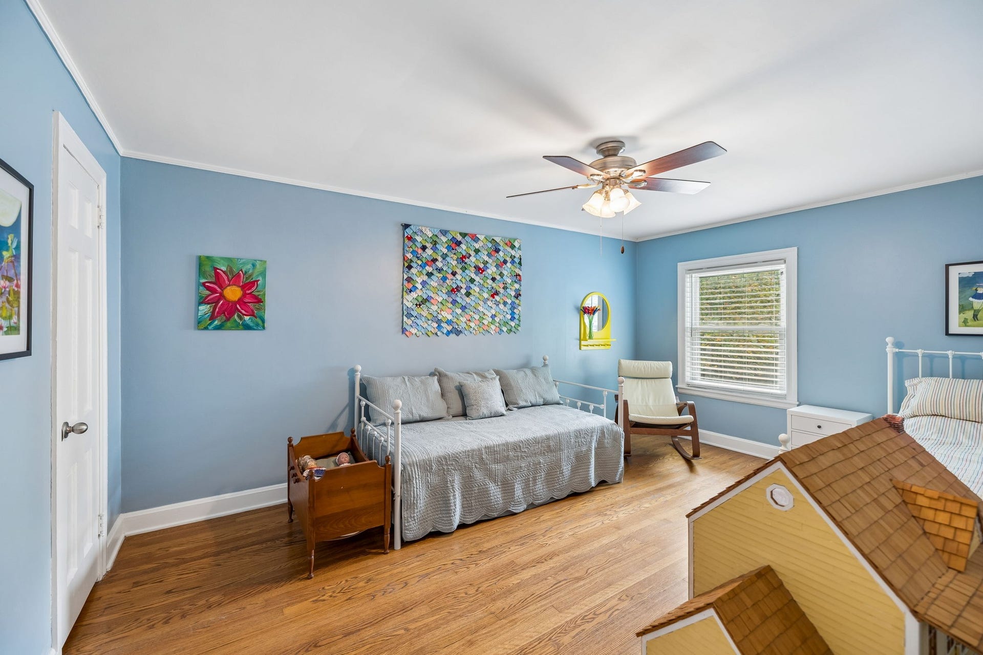 Bright, cheerful, and full of possibilities. This spacious bedroom offers beautiful hardwood floors, abundant natural light, and plenty of room to create a space that grows right along with you.