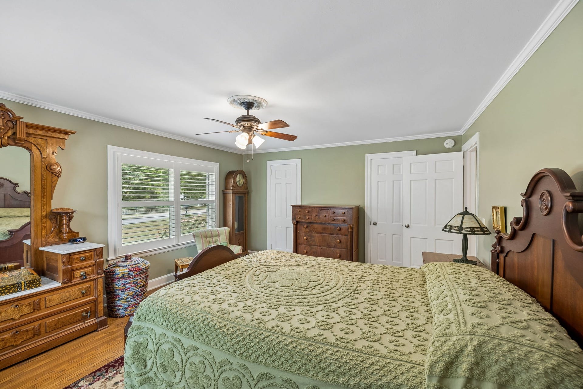 Theres something especially inviting about a bedroom with this much character. Natural light fills the room, while the original details and warm wood floors, and double closets give it that timeless feeling that makes a house feel like home.