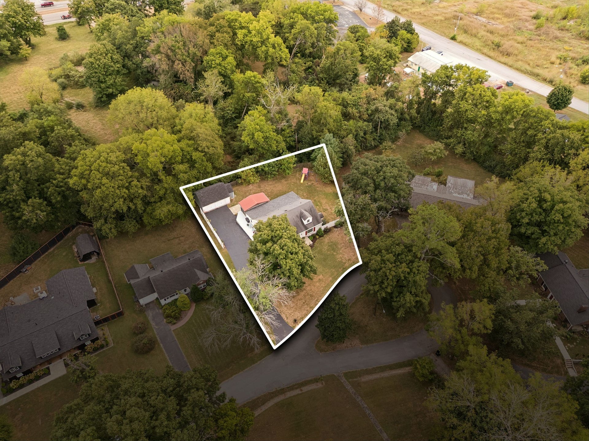 Privacy is one of the things you notice here. Mature trees surround the property, creating a backyard setting that feels tucked away and surprisingly serene.