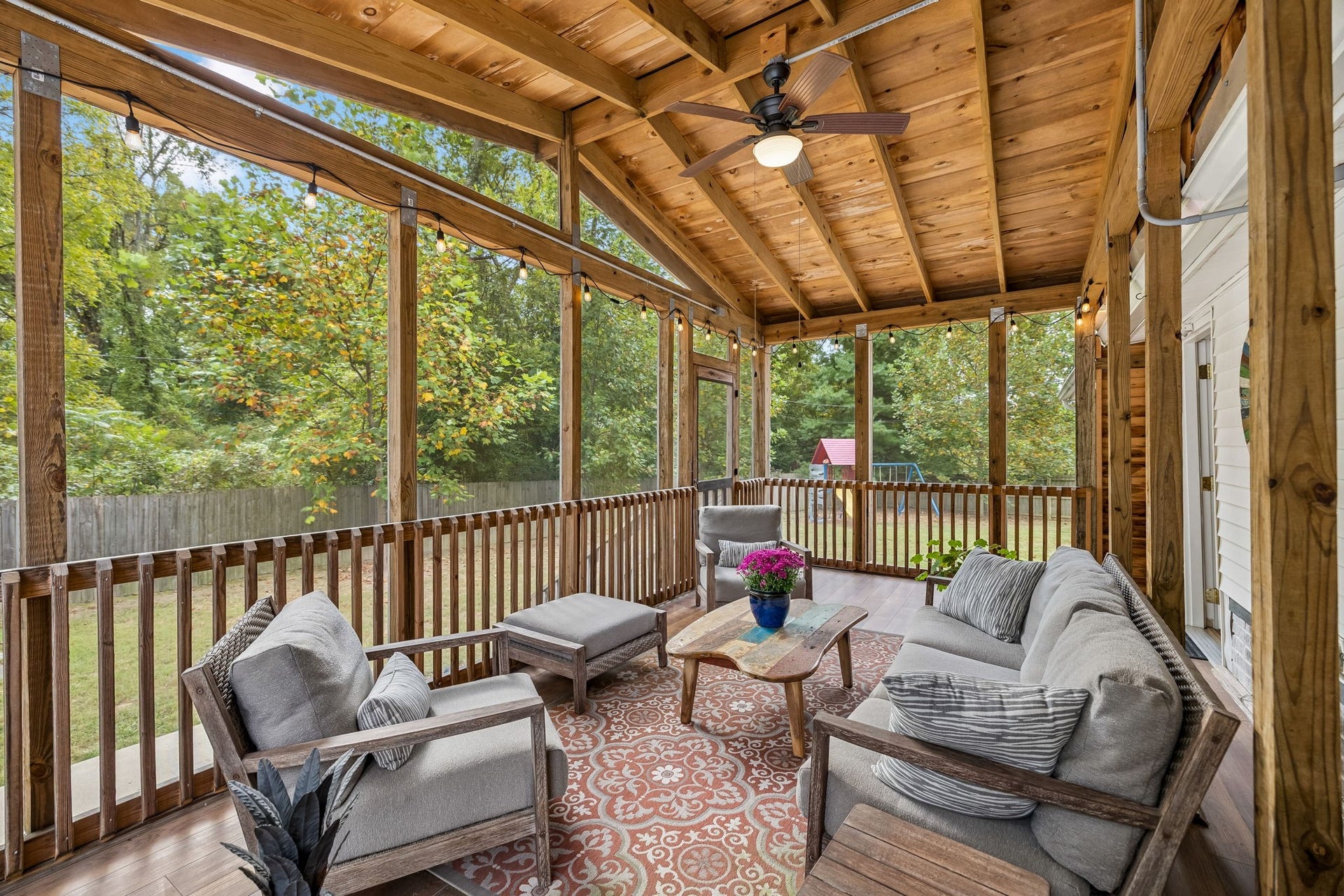 Then theres this. A screened porch surrounded by trees, where morning coffee lingers a little longer and evenings are meant to be spent outside.