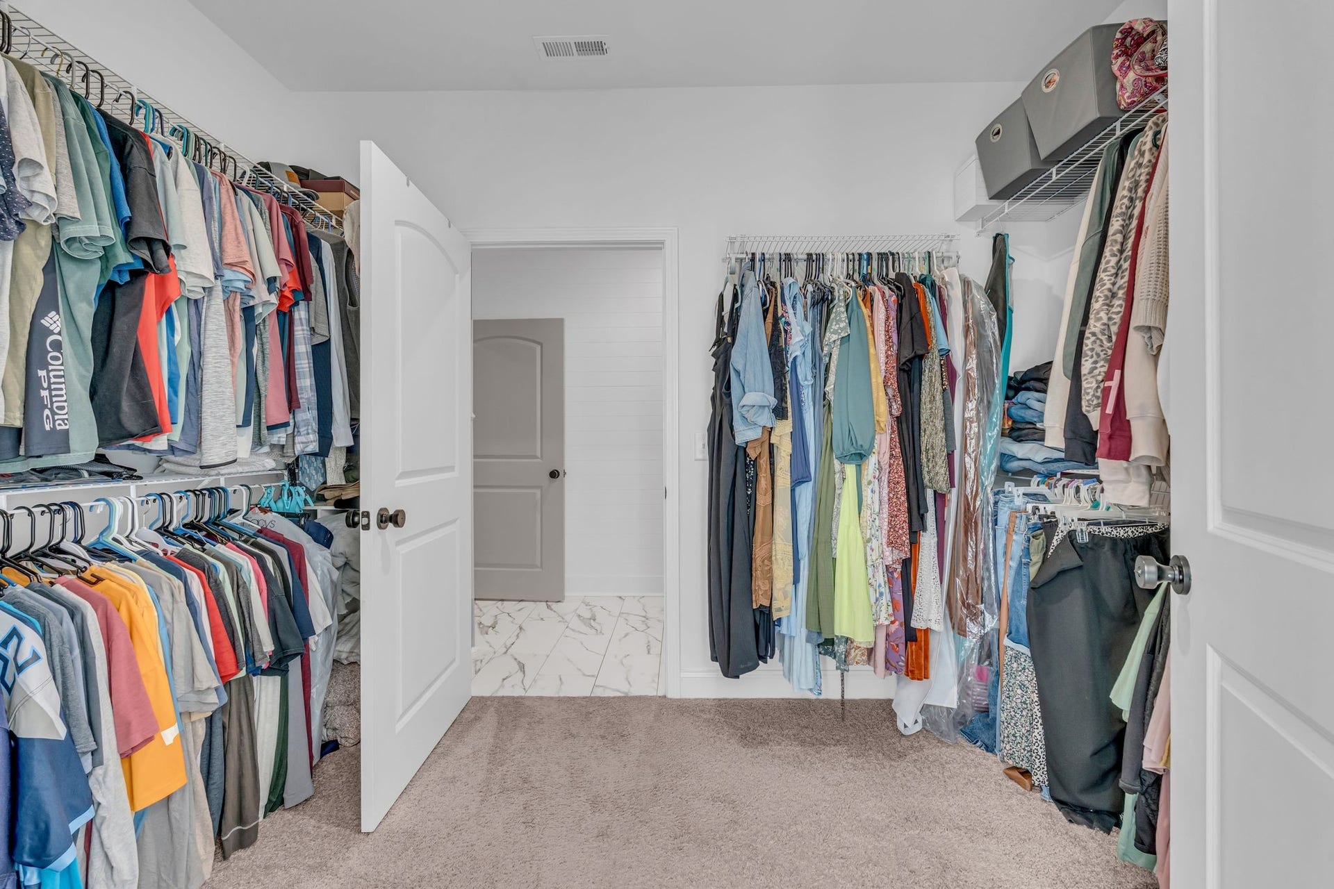 This layout is especially convenient with access to the primary closet through the laundry room.