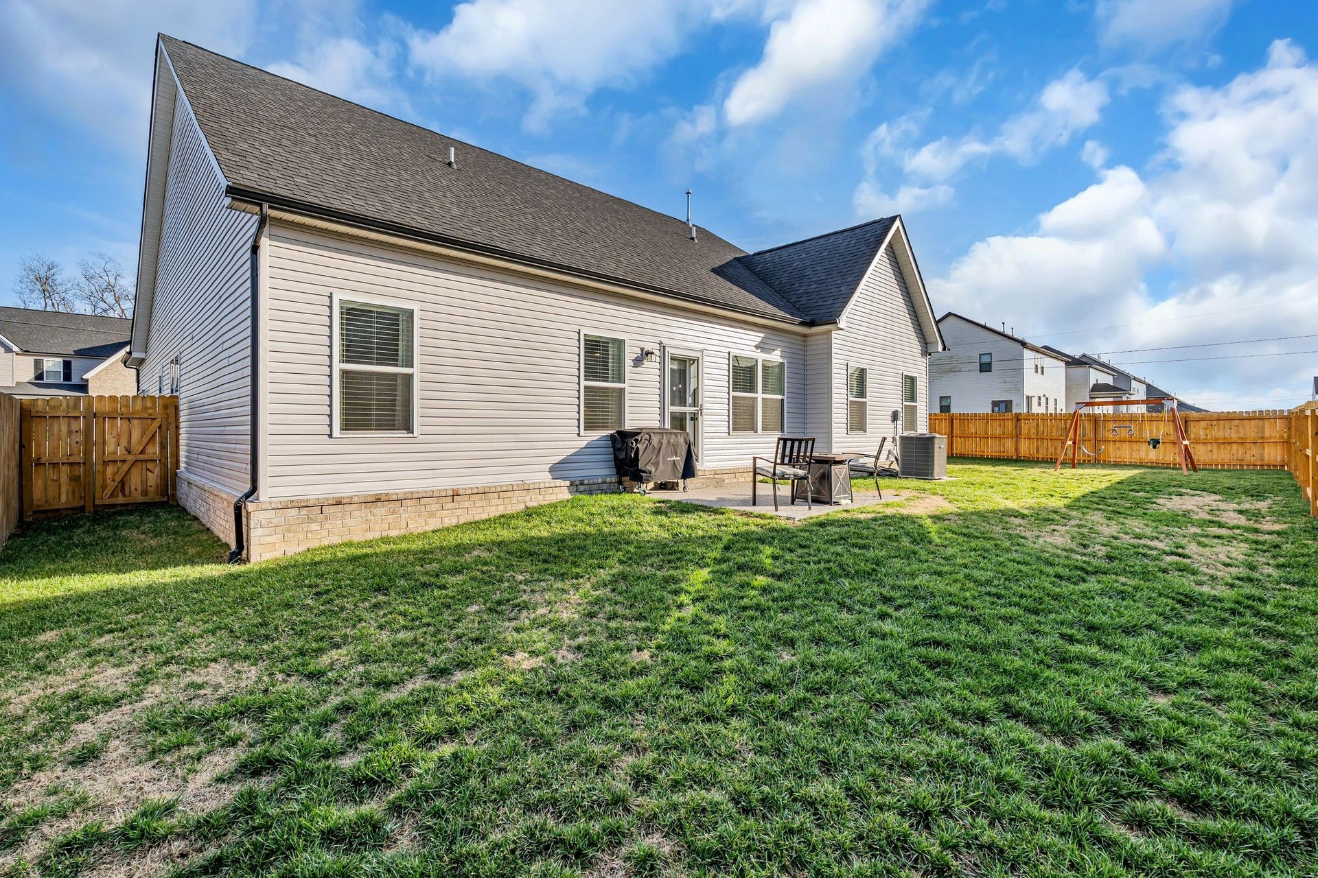 The backyard is very spacious and the fence extends around the corner.