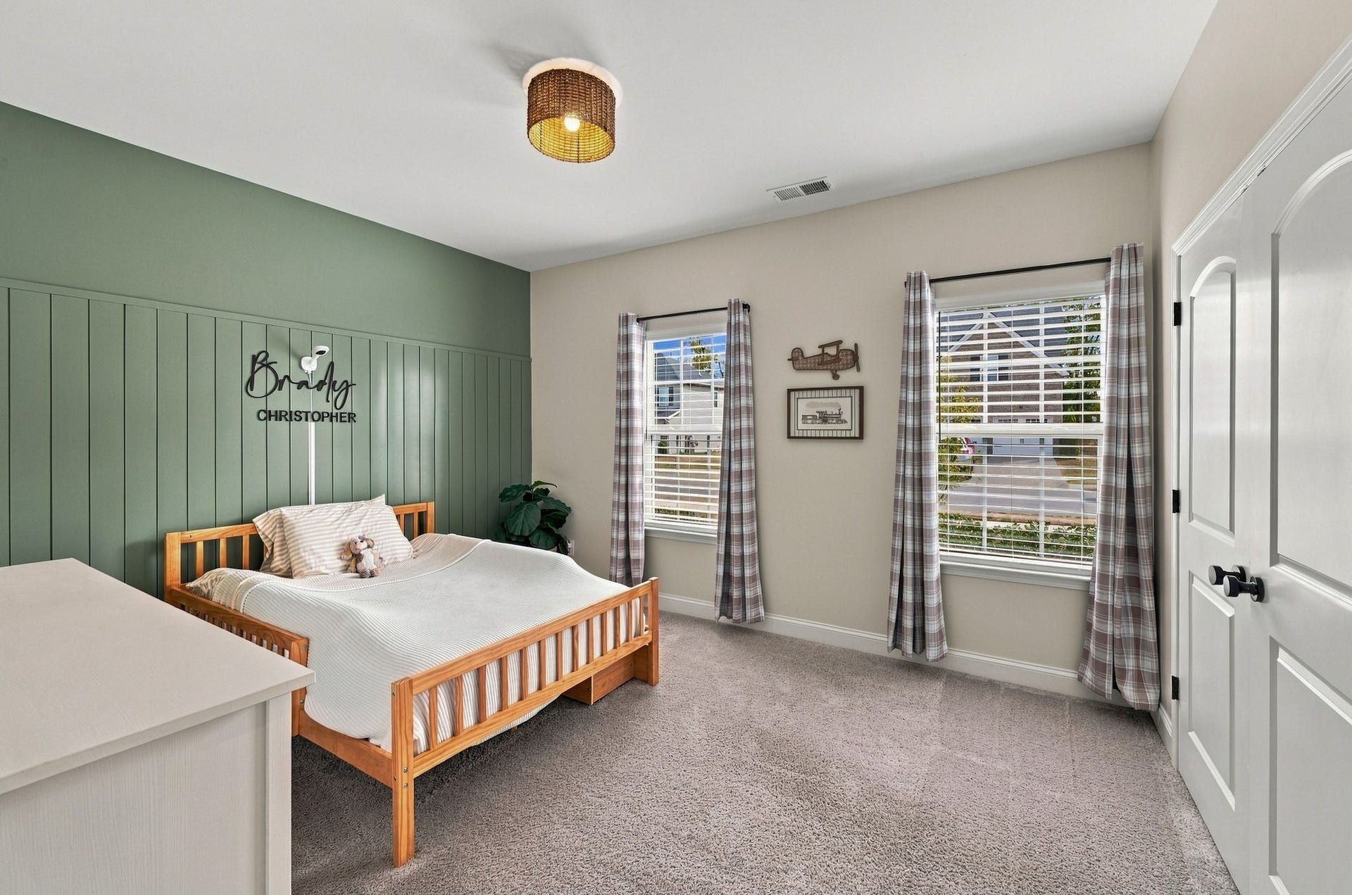 Bedroom 2 features an accent wall and large closet.