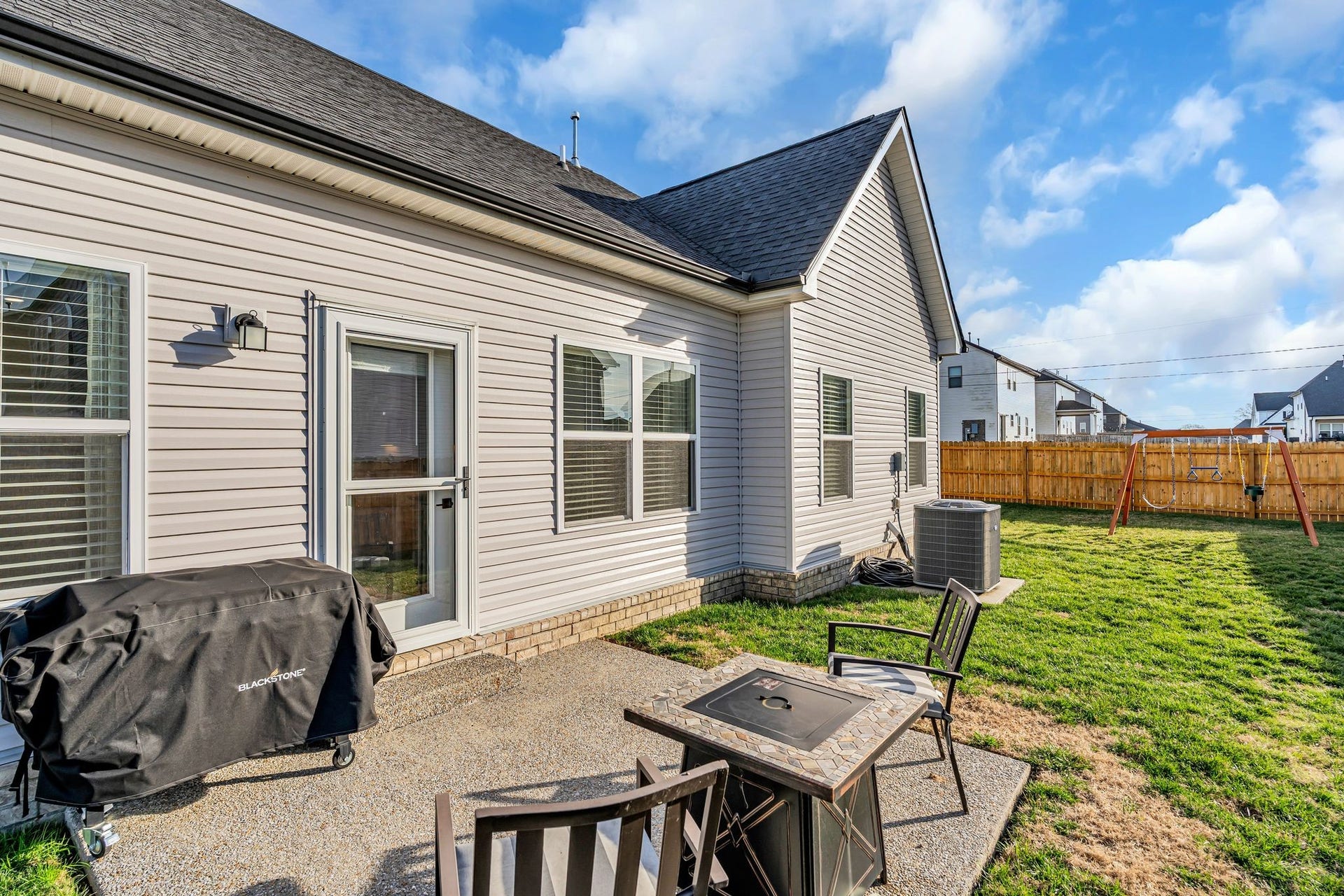 The backyard is very spacious and the fence extends around the corner.