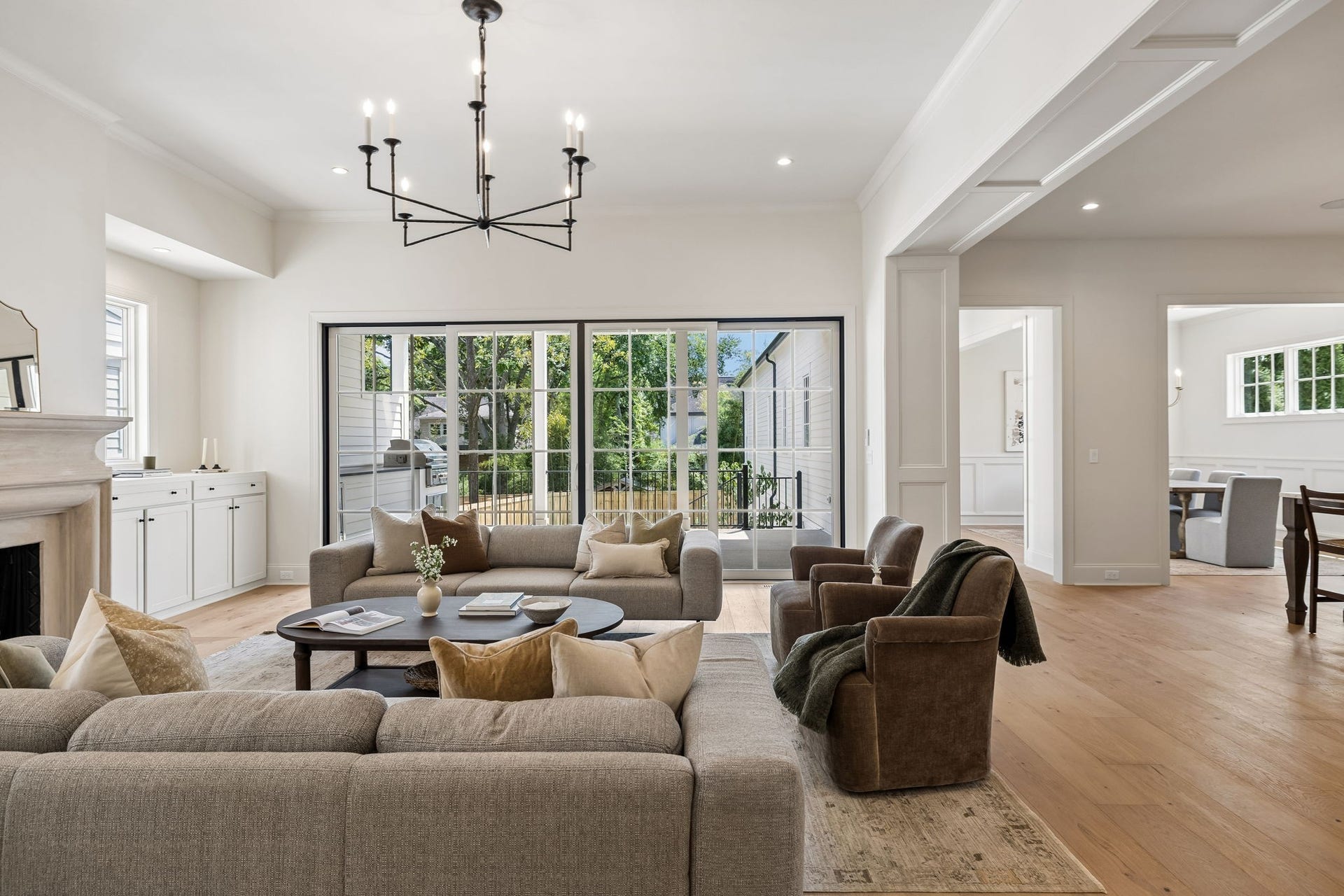 1133 Maplehurst Ln, Nashville, TN 37204 Expansive glass doors connect the great room directly to the covered outdoor living area, filling the space with natural light and extending everyday living and entertaining outdoors.