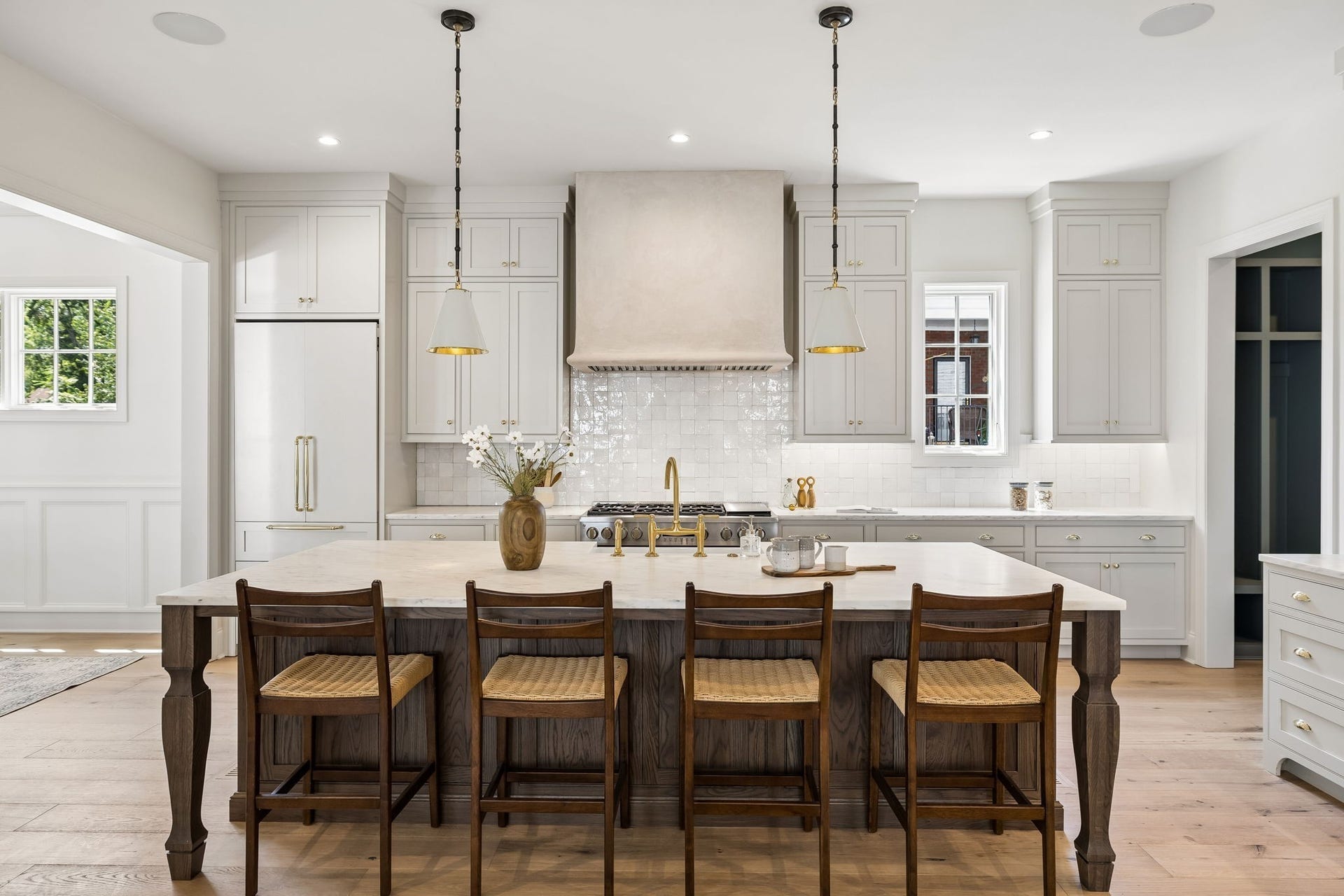 1133 Maplehurst Ln, Nashville, TN 37204 Thoughtful details include extensive cabinetry, illuminated open shelving, stone countertops, brass hardware, and abundant storagebeautifully combining form and function