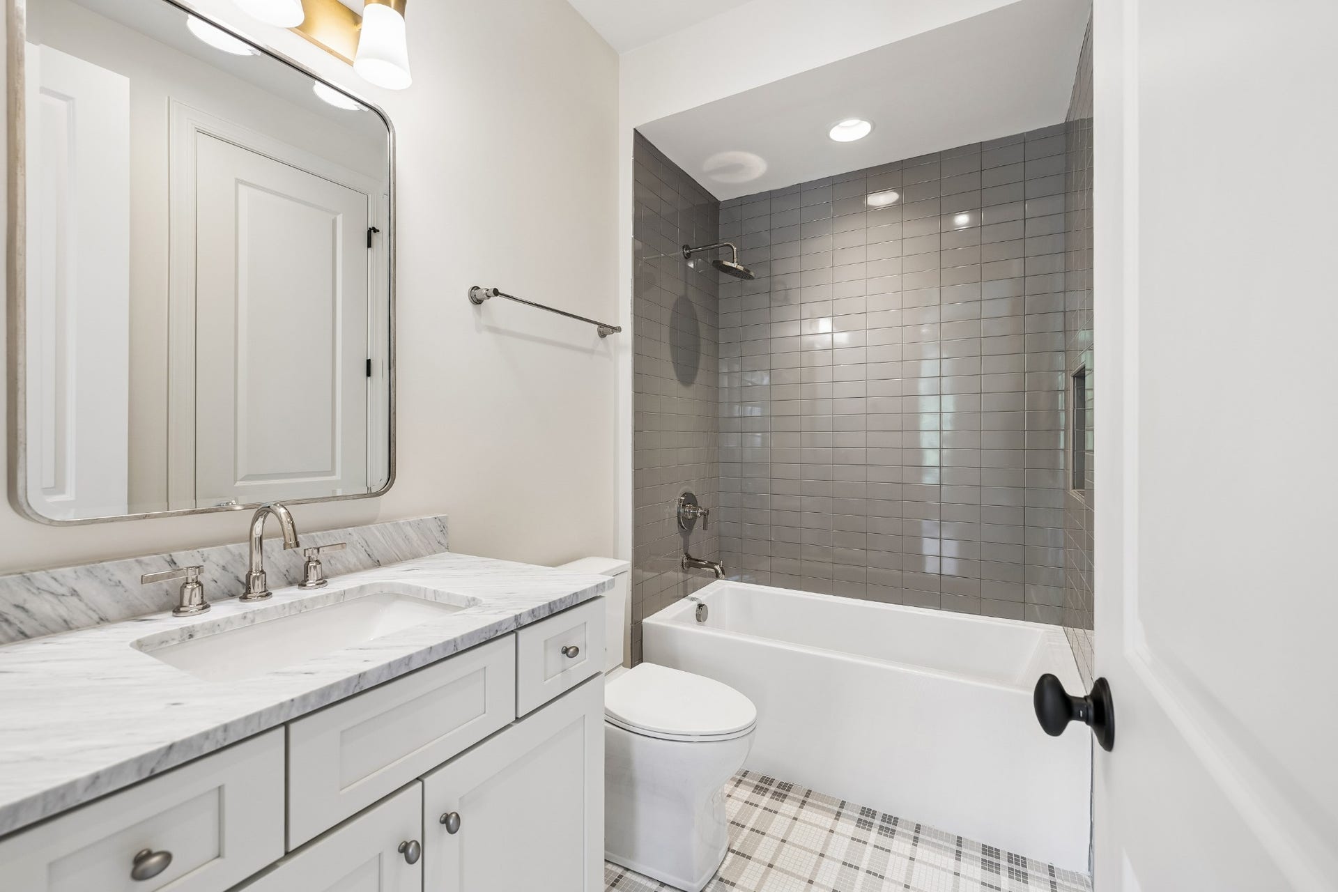1133 Maplehurst Ln, Nashville, TN 37204 Spacious Bedroom 3 offers its own private bath and generous walk-in closet. The ensuite bath blends modern finishes with classic, timeless design for a polished and comfortable retreat.