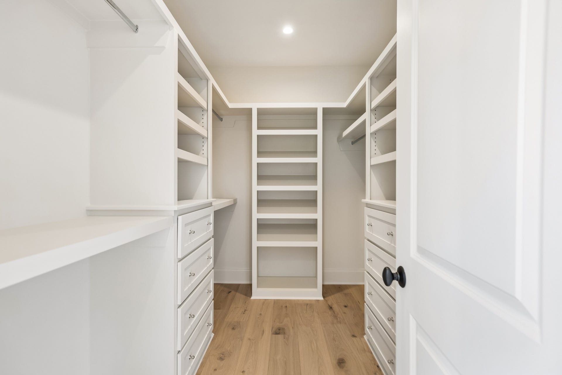 1133 Maplehurst Ln, Nashville, TN 37204 Tucked away down its own hallway, Bedroom 5 offers exceptional privacyideal for guests, older children, or extended stays. The spacious suite includes a private full bath with double vanity and glass-enclosed shower, plus a large custom walk-in clos