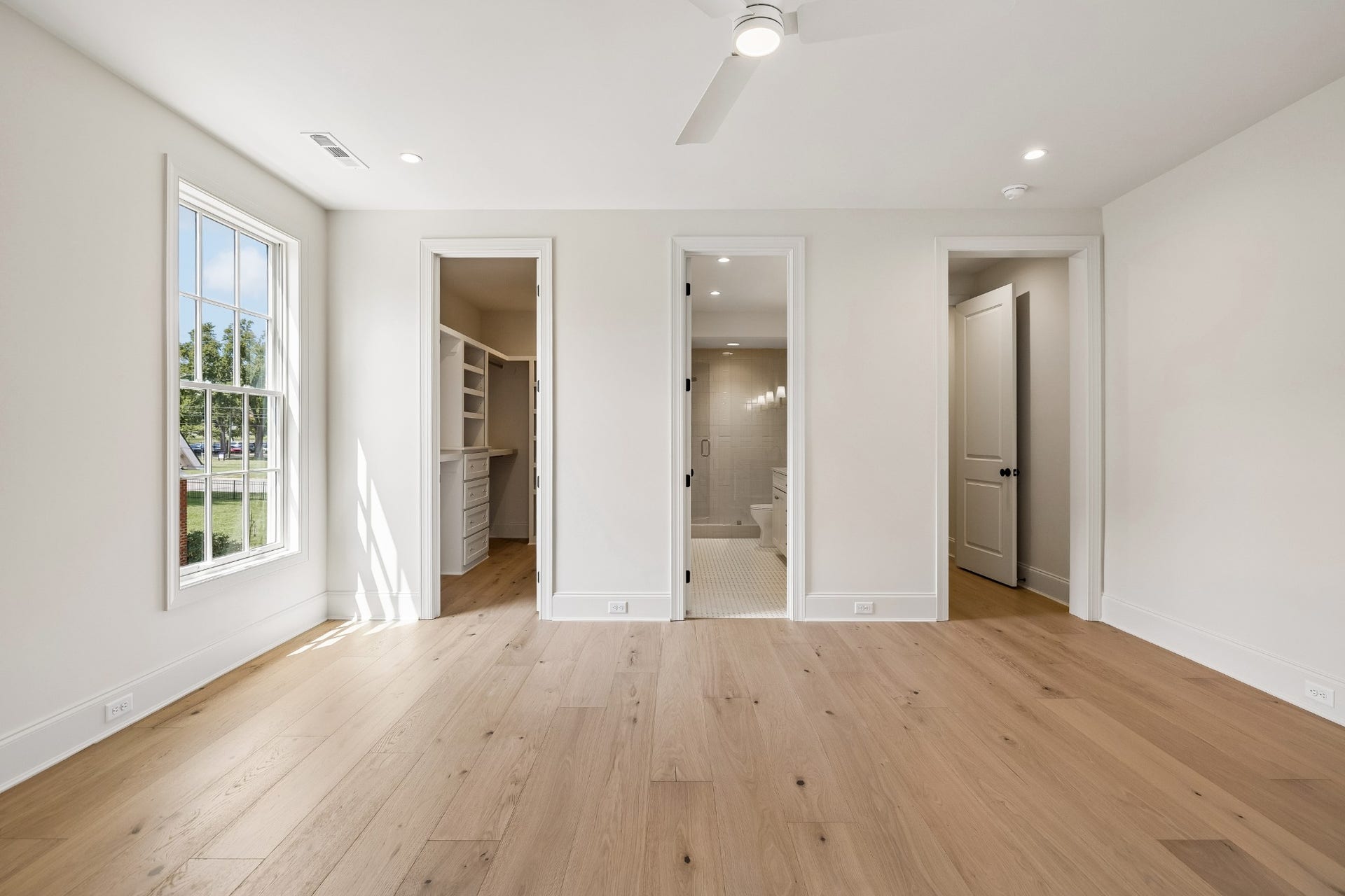 1133 Maplehurst Ln, Nashville, TN 37204 Tucked away down its own hallway, Bedroom 5 offers exceptional privacyideal for guests, older children, or extended stays. The spacious suite includes a private full bath with double vanity and glass-enclosed shower, plus a large custom walk-in clos