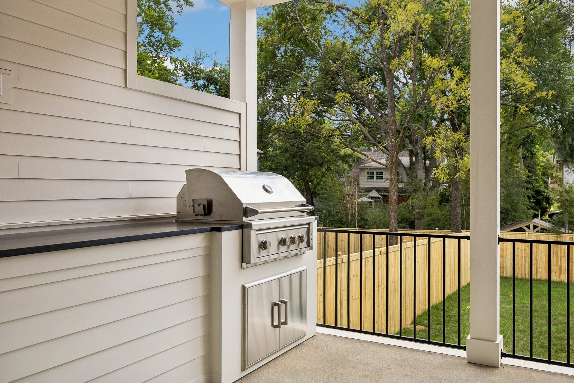 1133 Maplehurst Ln, Nashville, TN 37204 Built-in outdoor kitchen makes entertaining effortless with a stainless grill, generous counter space, and additional storageall protected beneath the covered porch.