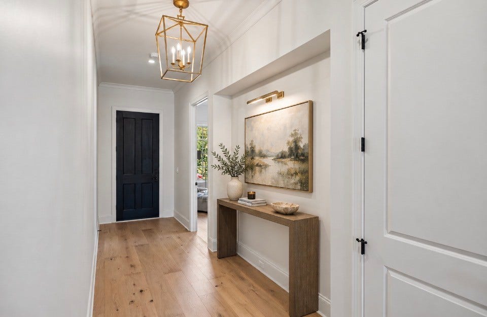 1133 Maplehurst Ln, Nashville, TN 37204 Welcoming foyer features hardwood floors, designer lighting, and a beautifully illuminated architectural nichean ideal spot to showcase artwork and create a memorable first impression.