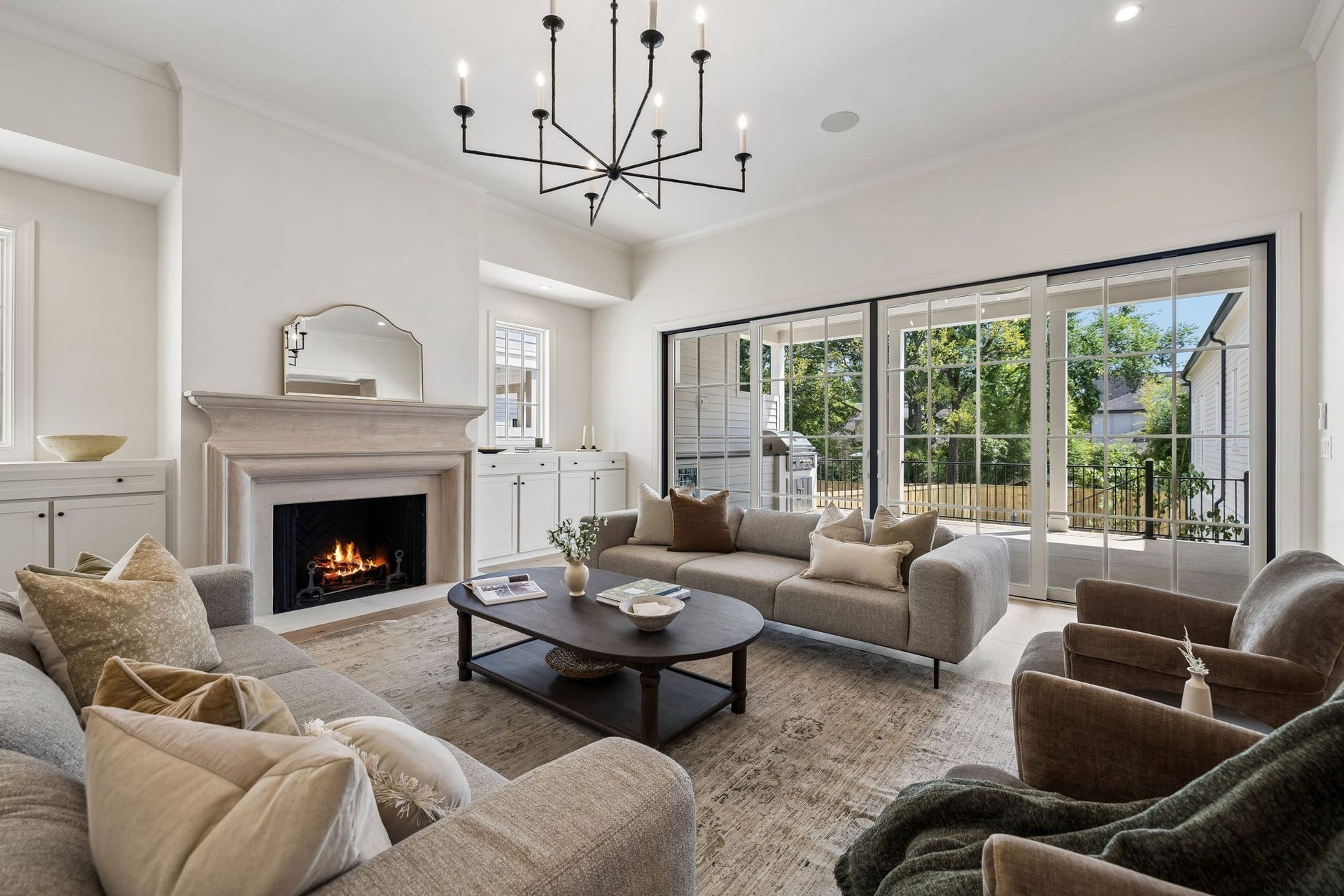 1133 Maplehurst Ln, Nashville, TN 37204 A wide architectural opening connects the great room and kitchen while maintaining definition between the spaces. Thoughtful millwork and abundant natural light elevate the open-concept design.